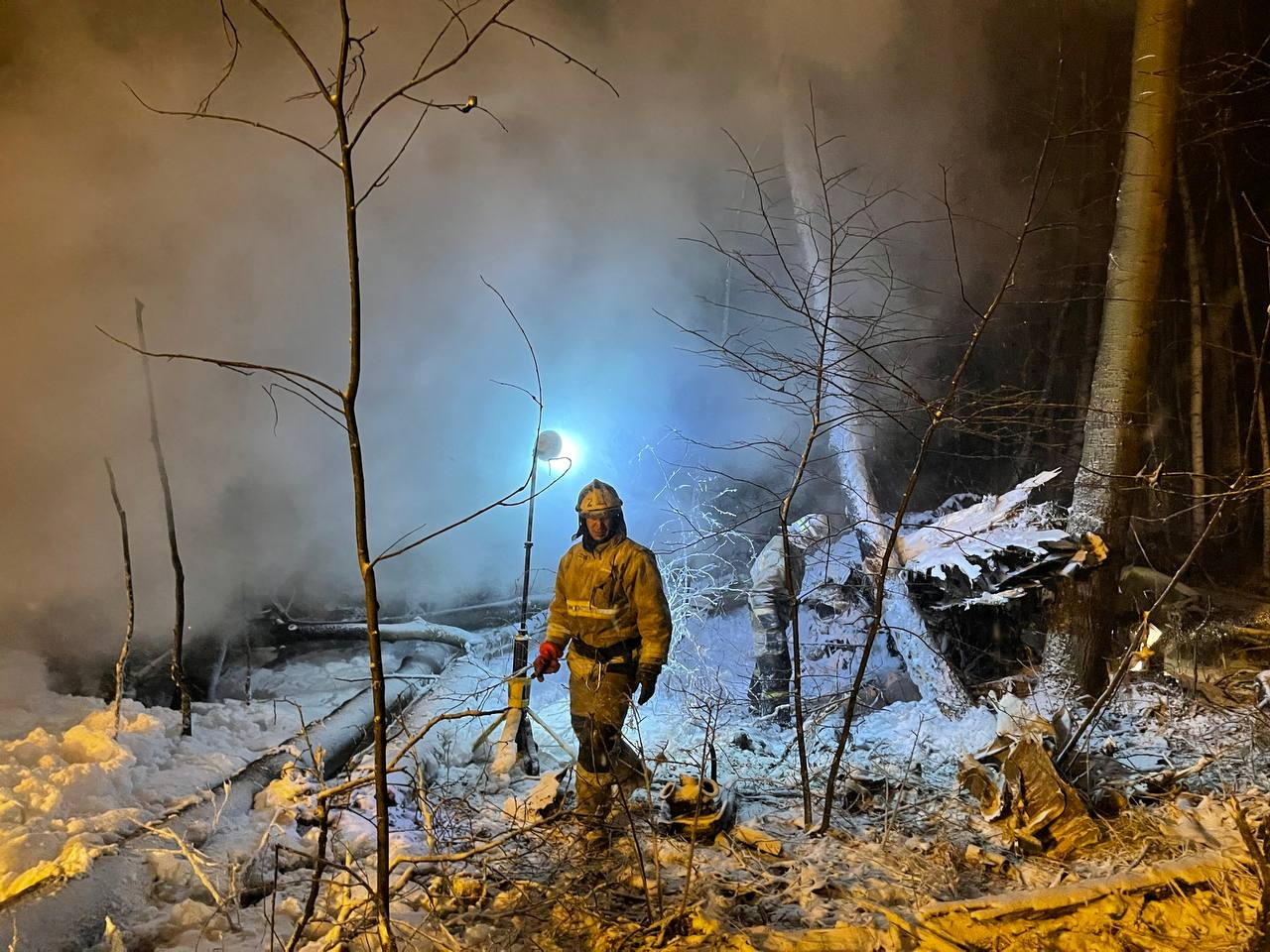 Emergency specialists work at the crash site of the Antonov An-12 cargo plane in Irkutsk region, Russia November 3, 2021. Press service of the Governor of the Irkutsk region/Handout via REUTERS 