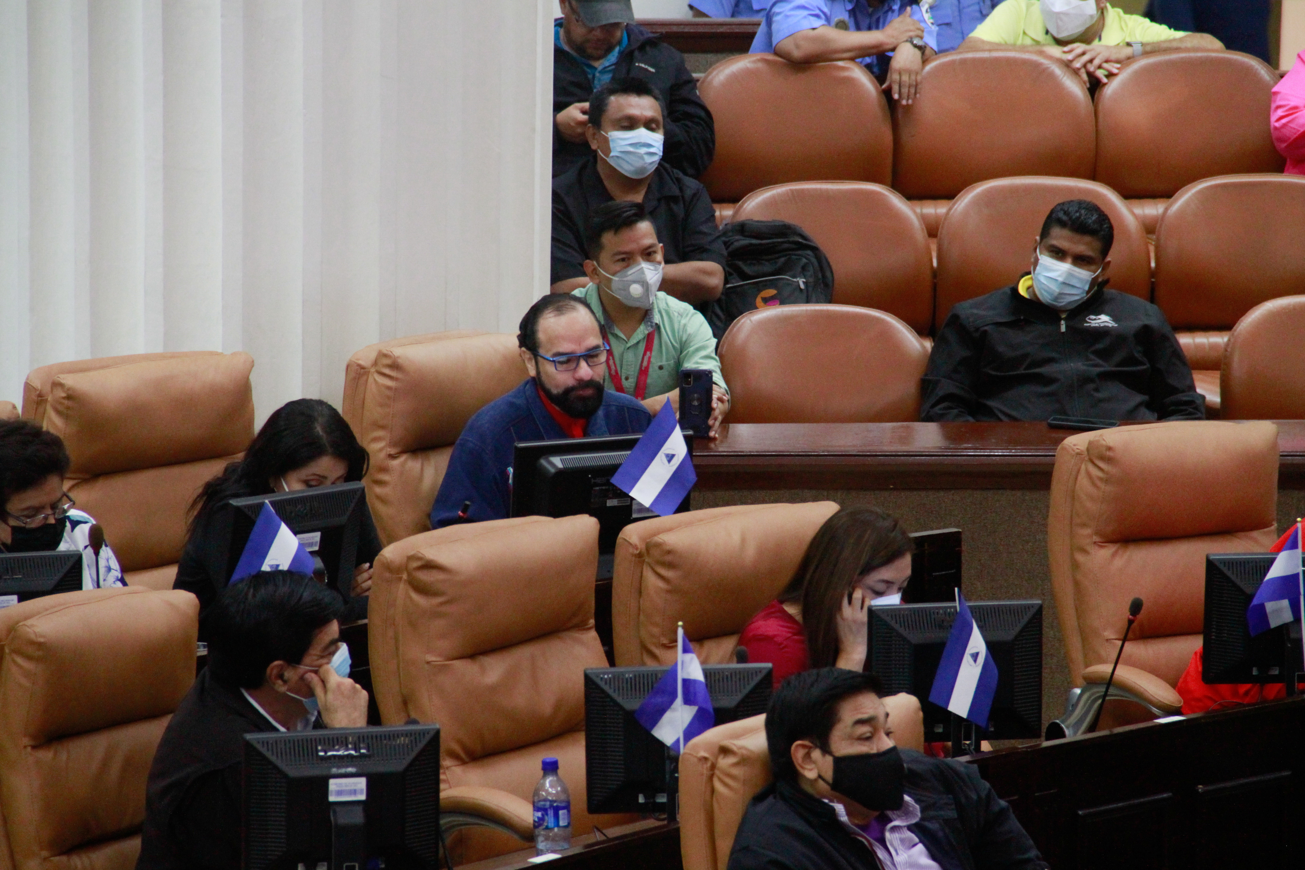 Nicaraguan lawmakers attend a session where they approved a law that calls on President Daniel Ortega to denounce the democratic charter of the Organization of the American States (OAS), a move that one lawmaker said would be a prelude to Nicaragua leaving the body, in Managua, Nicaragua November 16, 2021. REUTERS/Stringer 