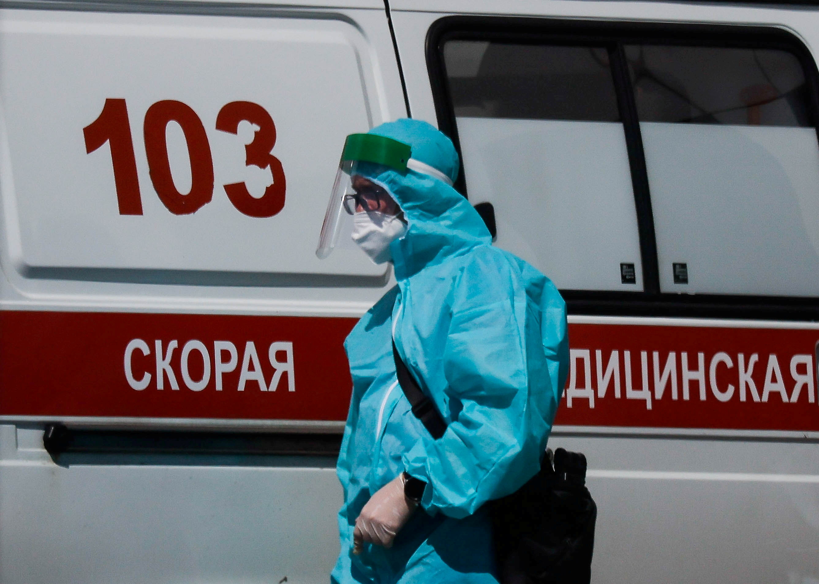 A medical specialist walks by an ambulance outside a hospital for patients infected with the coronavirus disease (COVID-19) in Moscow, Russia June 16, 2021. REUTERS/Maxim Shemetov/File Photo