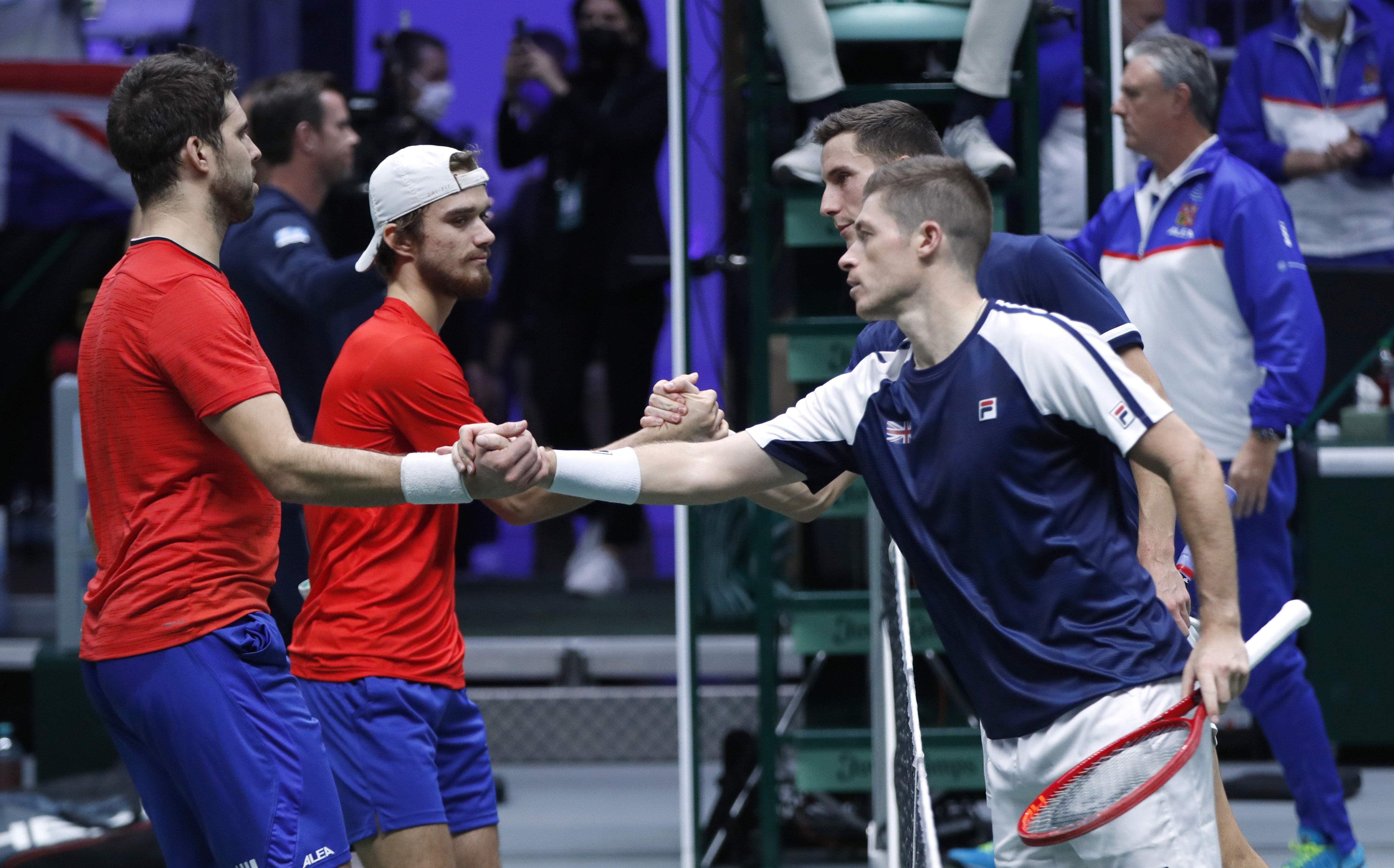 Tennis - Davis Cup Finals - Group C - Britain v Czech Republic - Olympiahalle, Innsbruck, Austria - November 28, 2021 Britain's Joe Salisbury and Neal Skupski shakes hands with Czech Republic's Tomas Machac and Jiri Vesely after winning their doubles match REUTERS/Leonhard Foeger