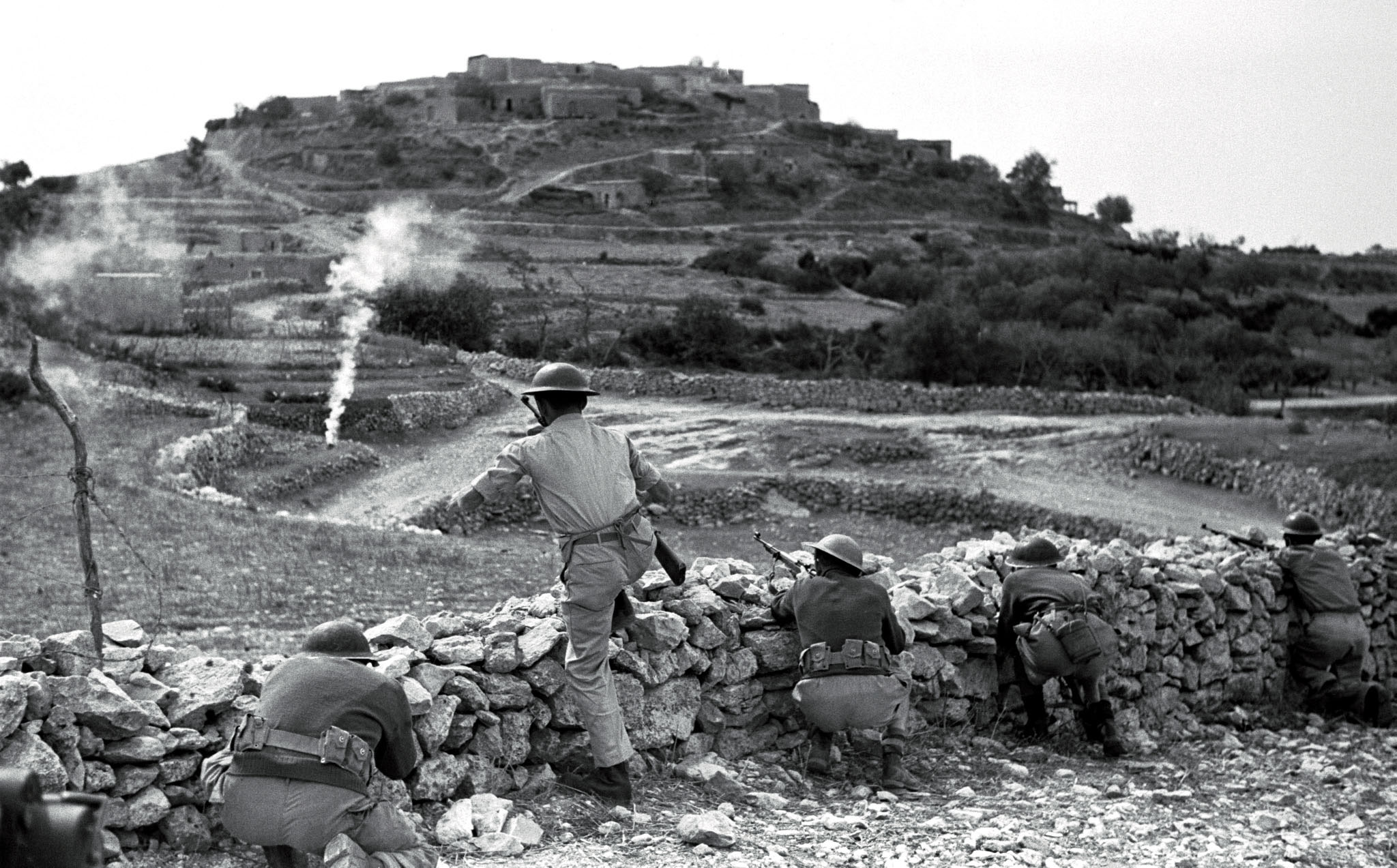 Israeli troops in action near an unidentified Arab village in the Galilee region during the opening stages of the 1948 War of Independence.  REUTERS