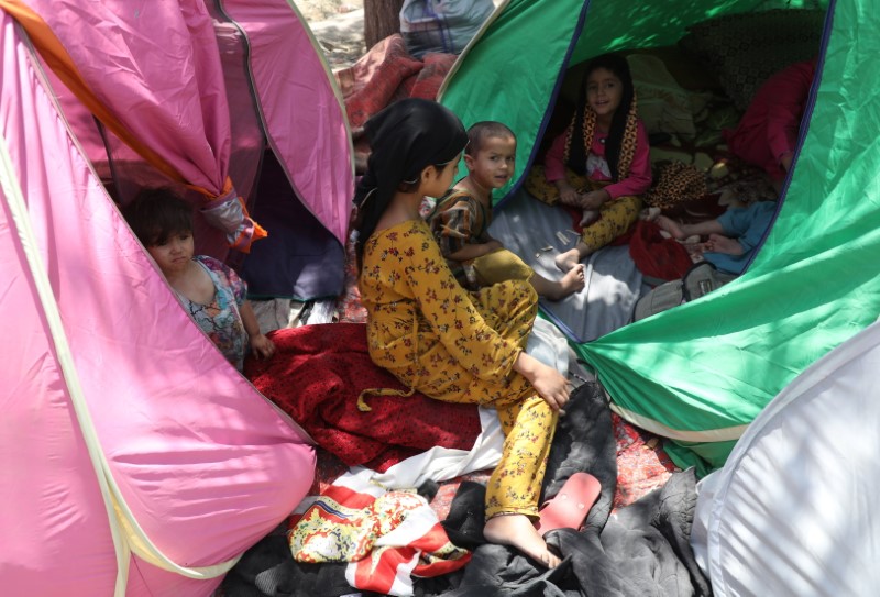 Internally displaced families from northern provinces, who fled from their homes due the fighting between Taliban and Afghan security forces, take shelter in a public park in Kabul