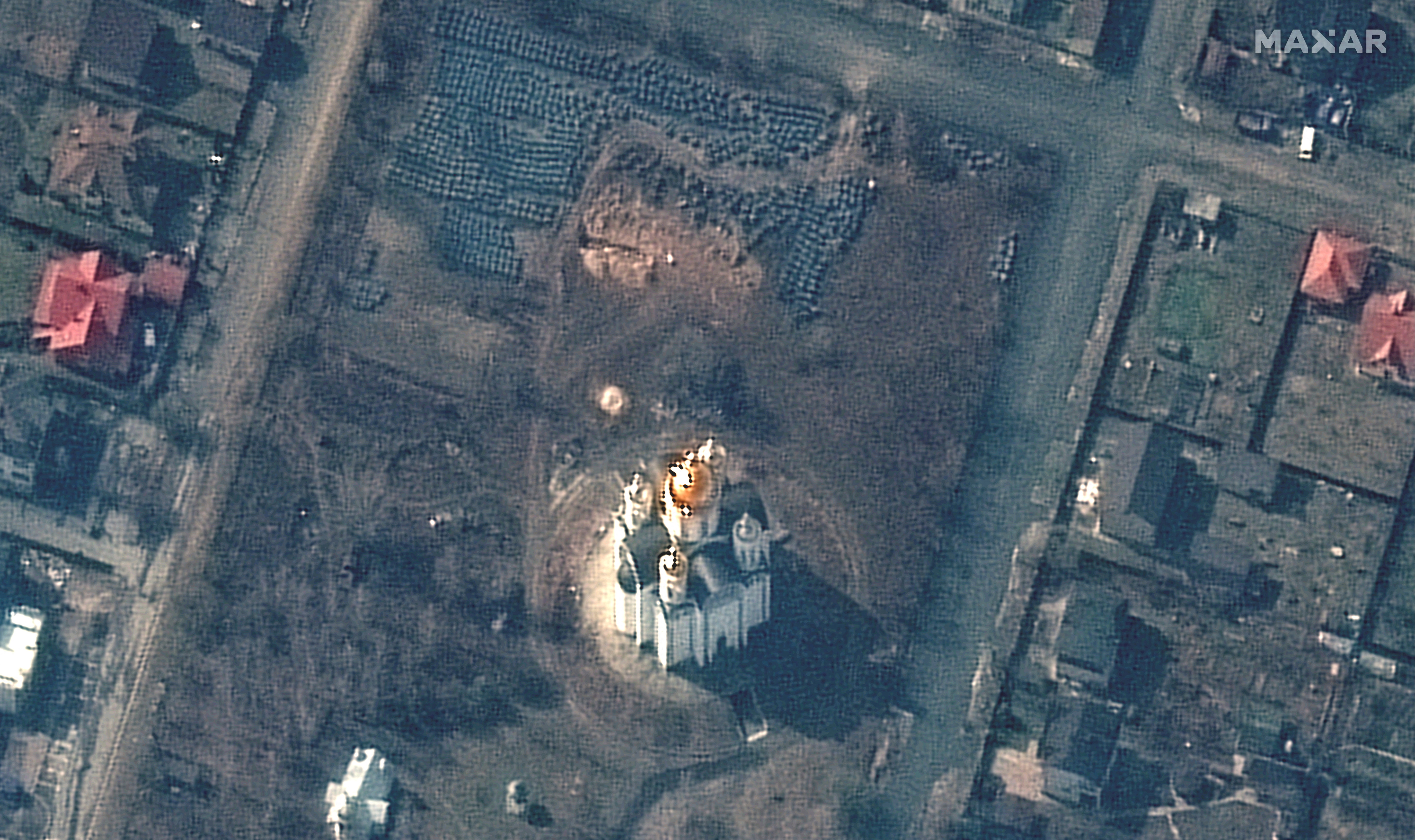 A satellite image shows the grave site near the Church of St. Andrew and Pyervozvannoho All Saints, in Bucha