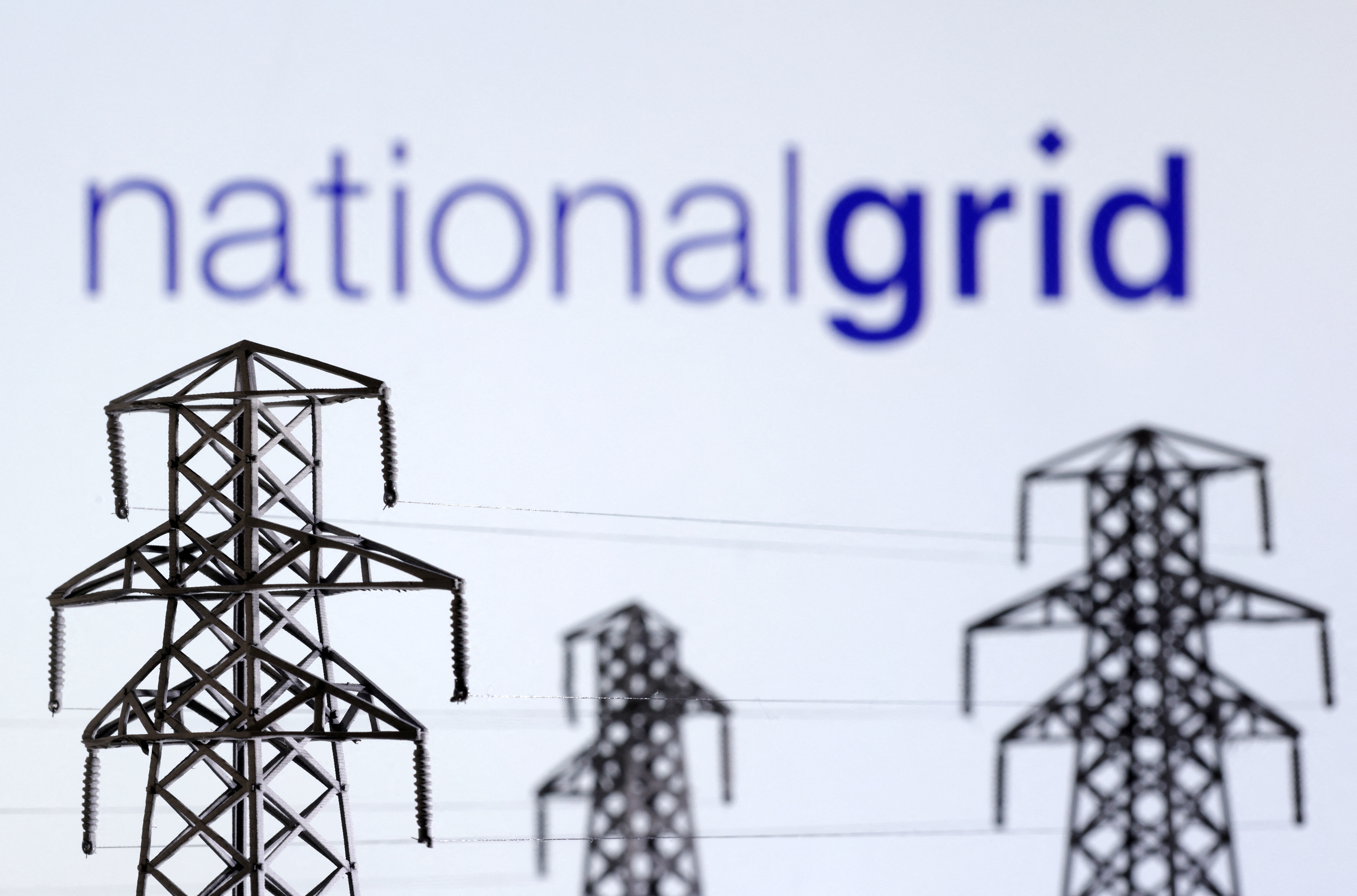 Illustration shows Electric power transmission pylon miniatures and National Grid logo