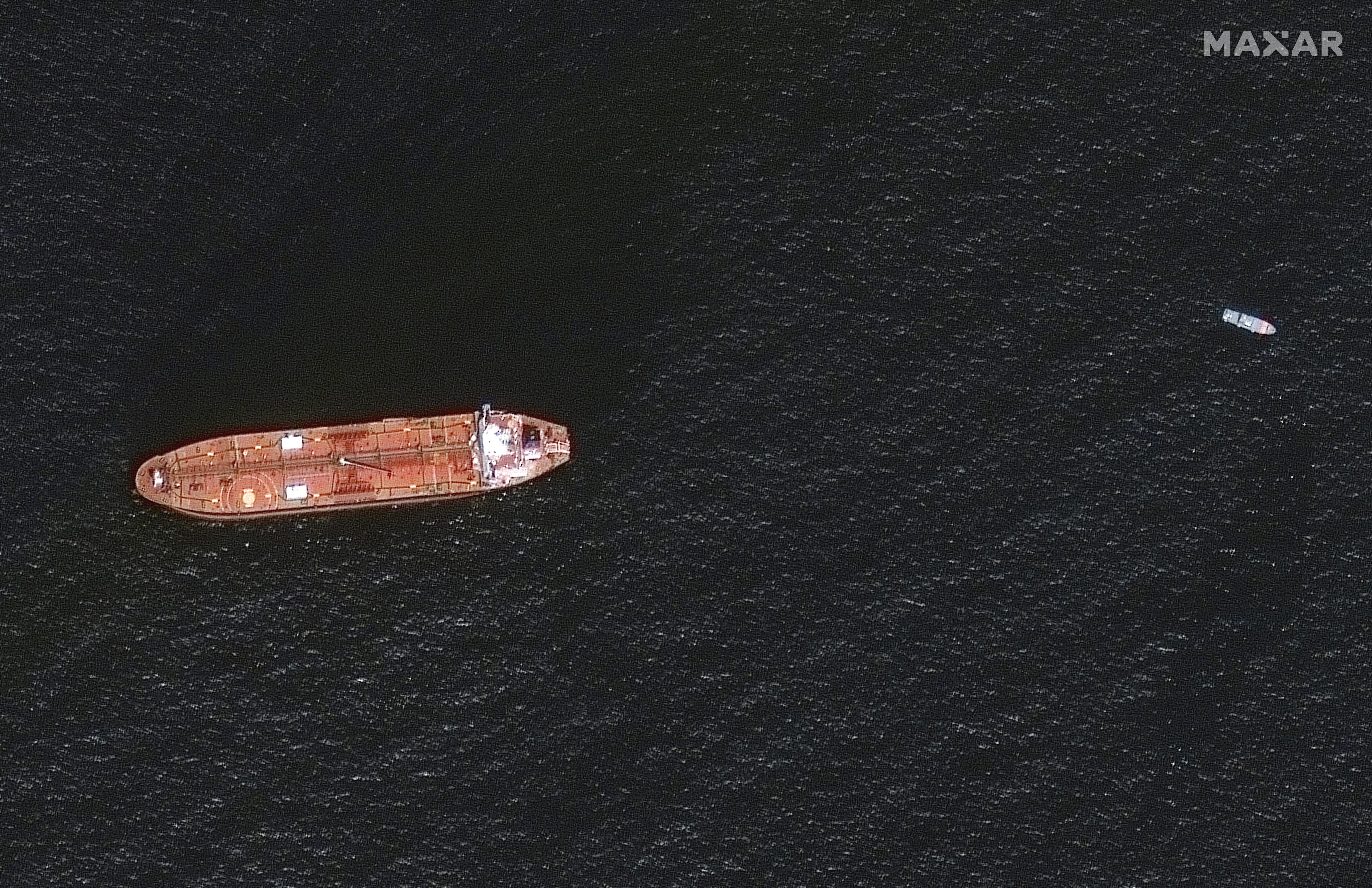 A satellite image shows the damaged Mercer Street Tanker moored off the coast of Fujairah