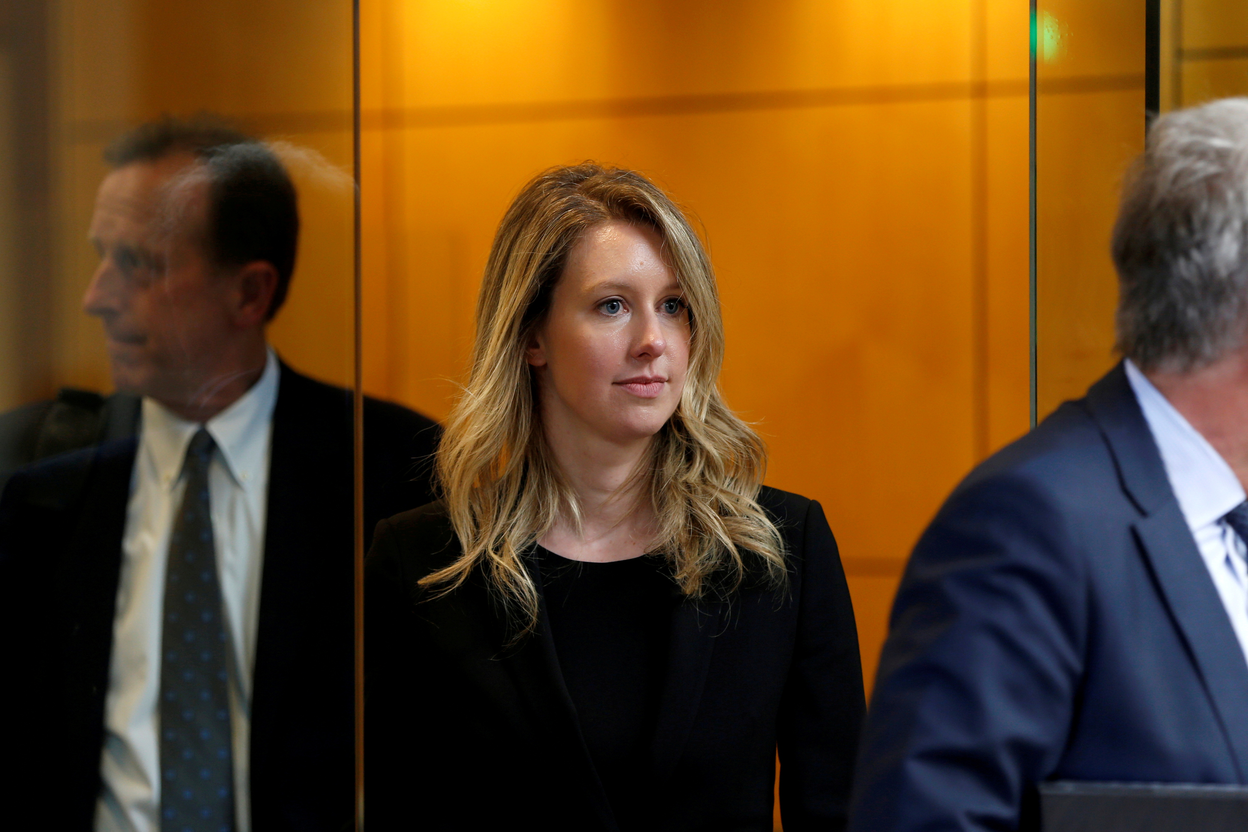 Former Theranos CEO Elizabeth Holmes leaves after a hearing at a federal court in San Jose