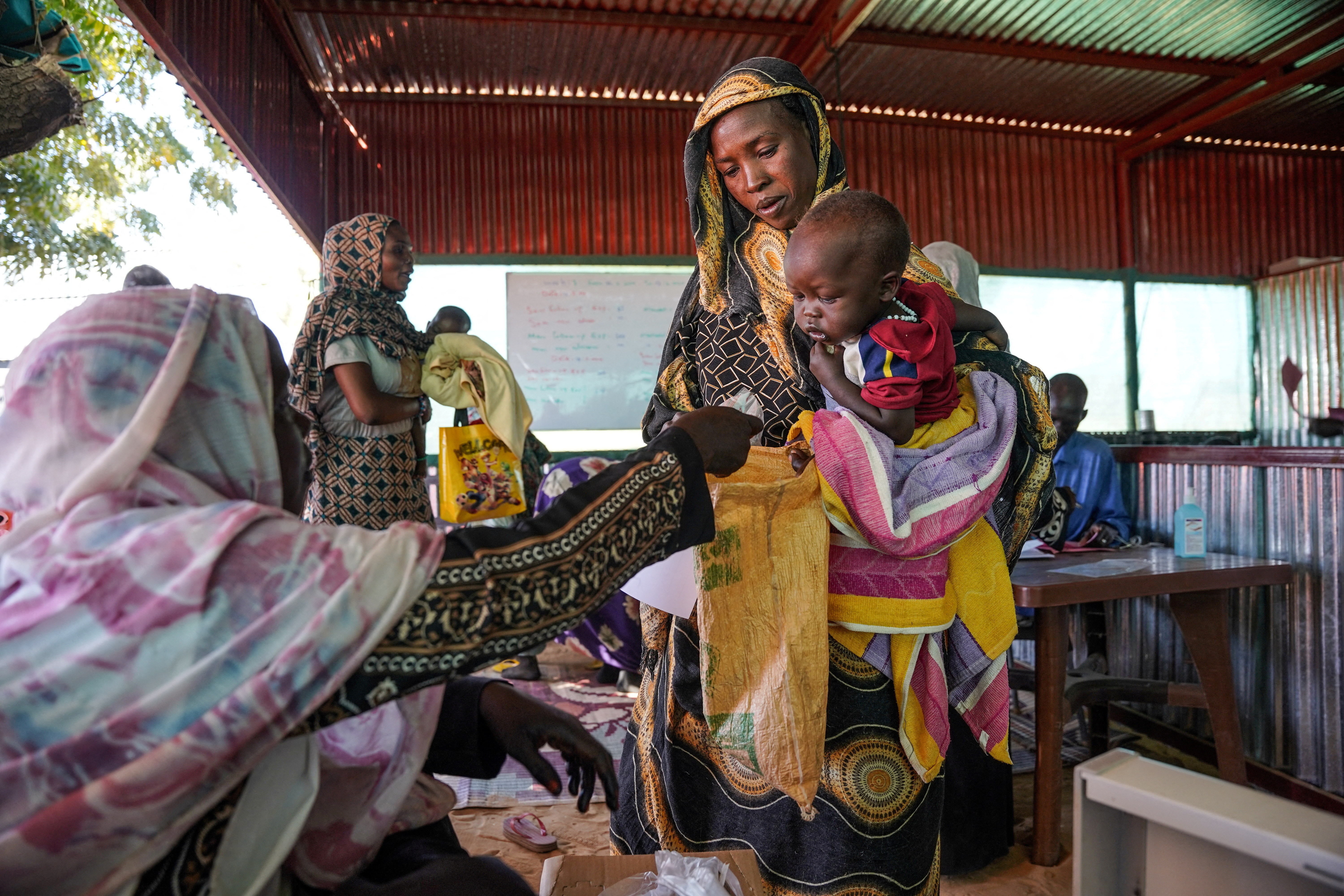 Handout photograph of a woman and baby at the Zamzam displacement camp in North Darfur