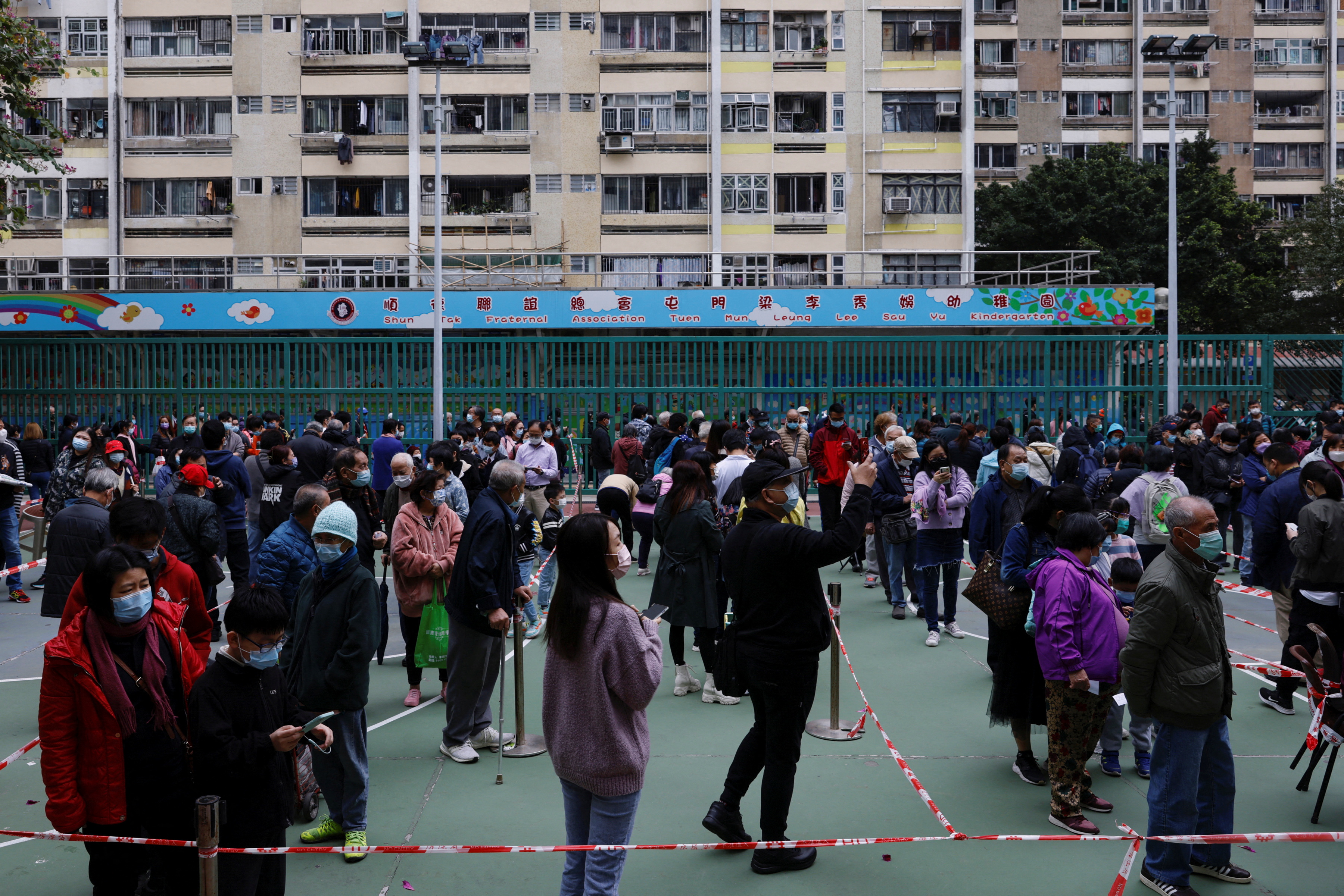 People queue up at a community testing centre for the coronavirus disease (COVID-19), in Tuen Mun, Hong Kong