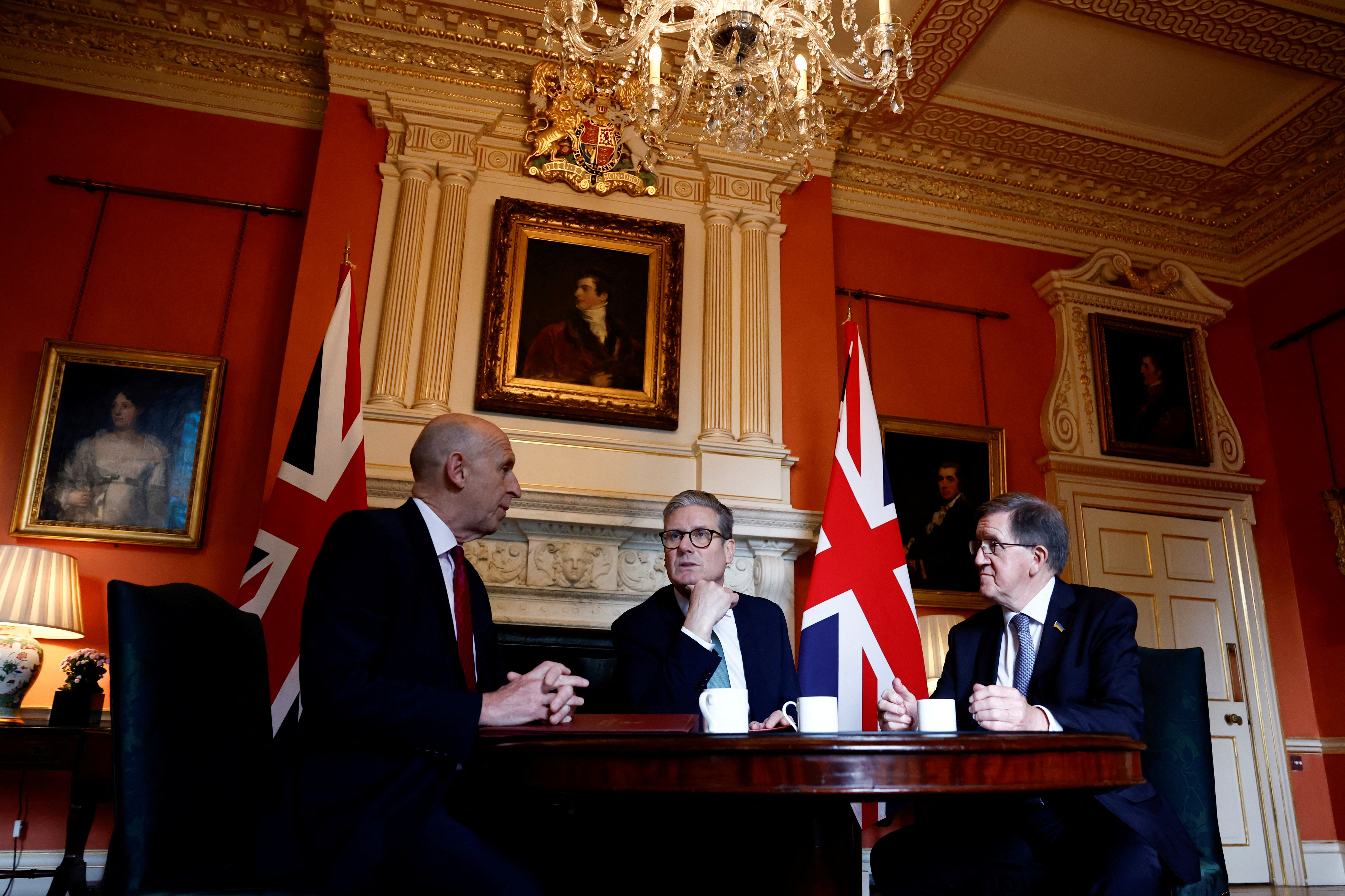 Britain's PM Keir Starmer meets Defence Secretary John Healey and Member of the House of Lords George Robertson at 10 Downing Street, in London