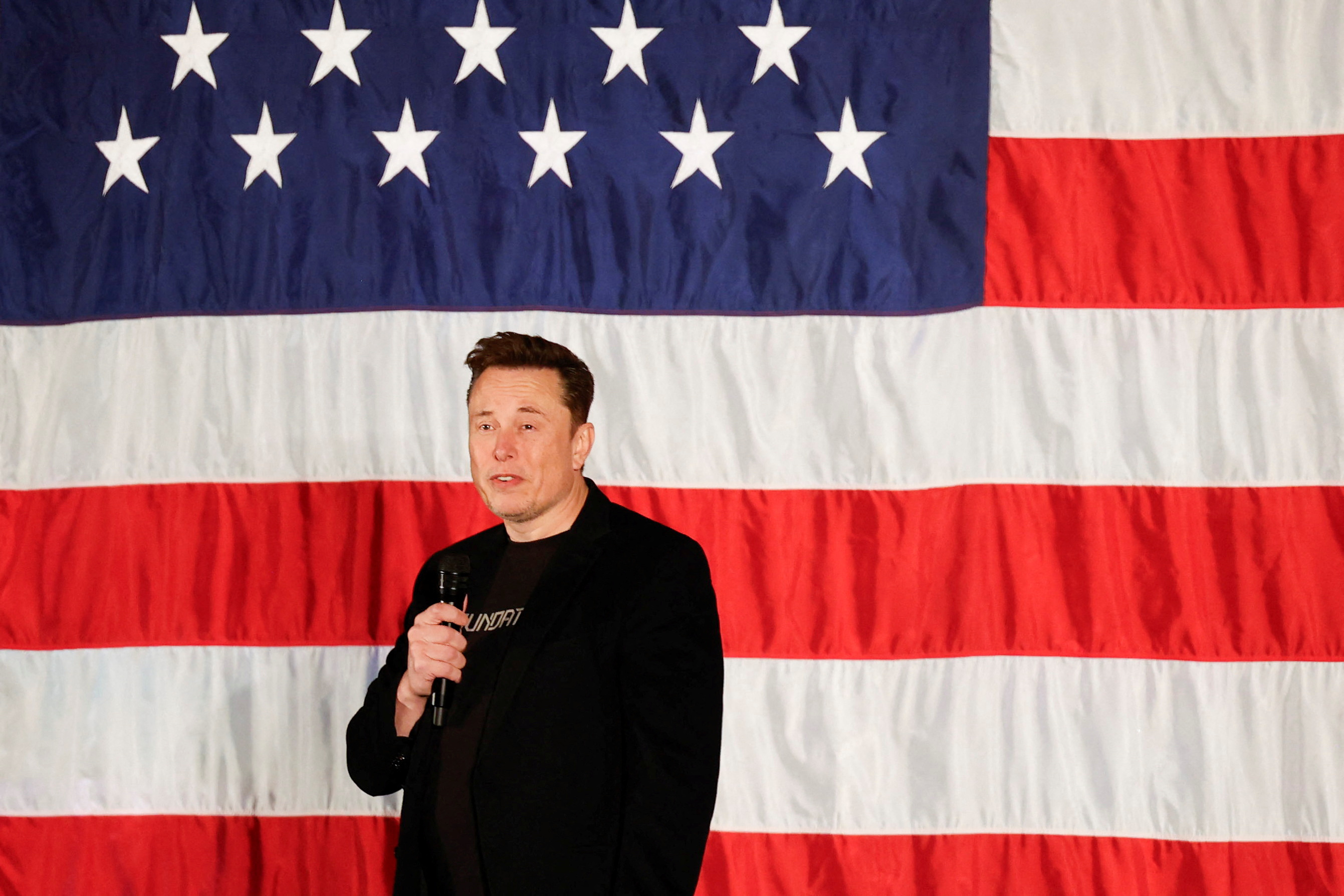 Tesla CEO and X owner Elon Musk speaks about voting during an America PAC Town Hall, in Folsom