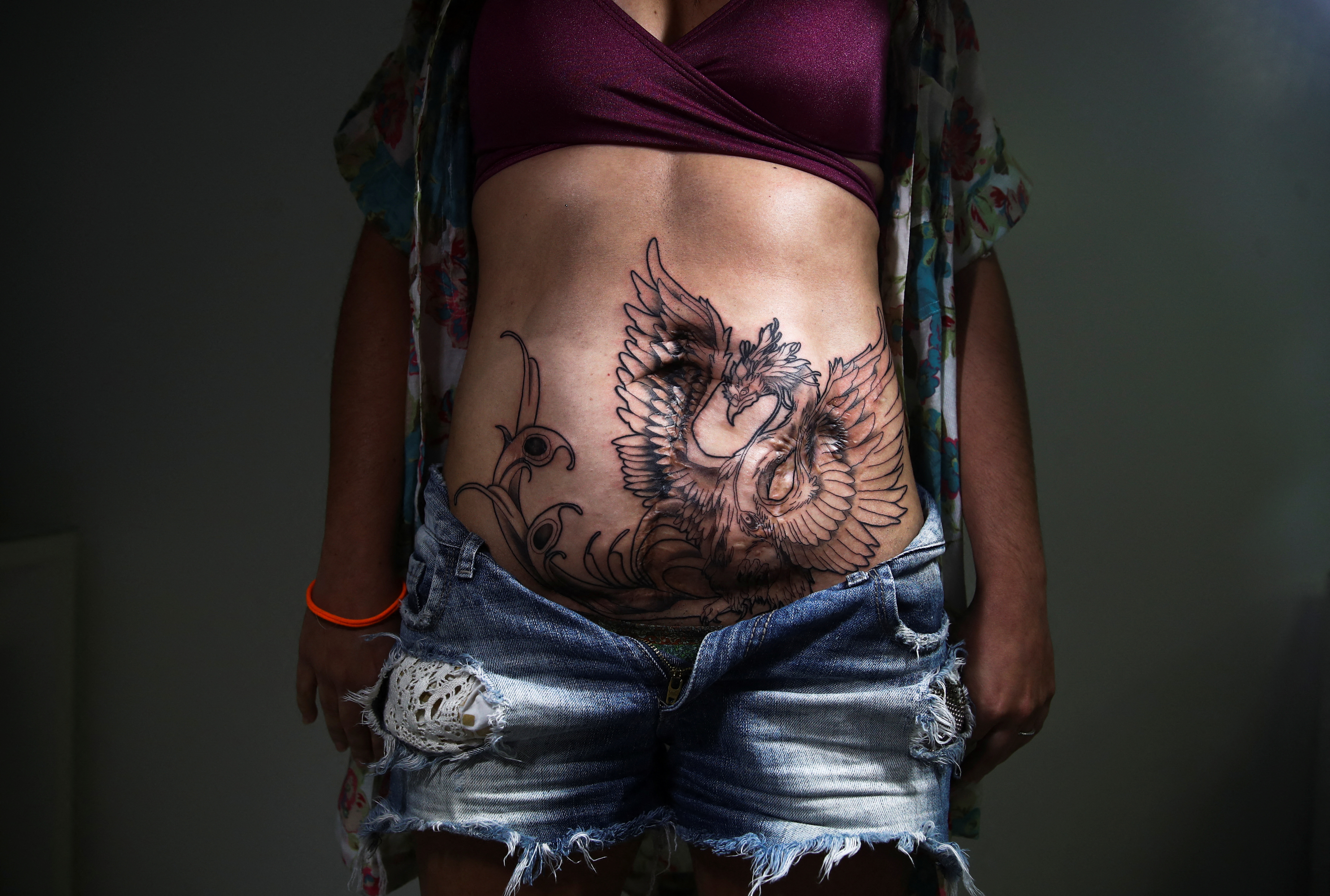 Turning trauma into art, Brazilian tattoo artist gives women reason to  smile