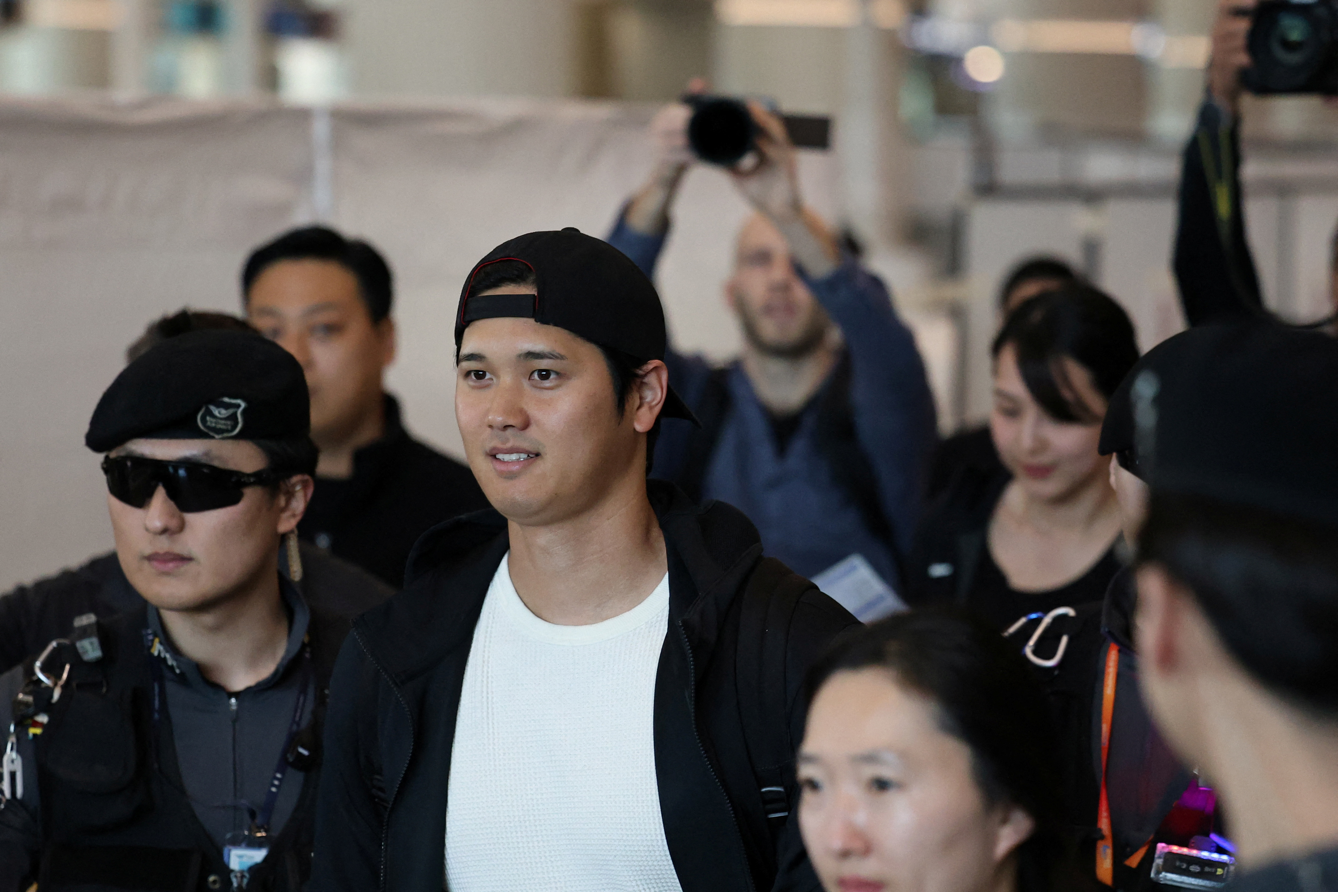 Los Angeles Dodgers' Japanese baseball star Shohei Ohtani arrives with his wife Mamiko Tanaka at the Incheon international airport in Incheon