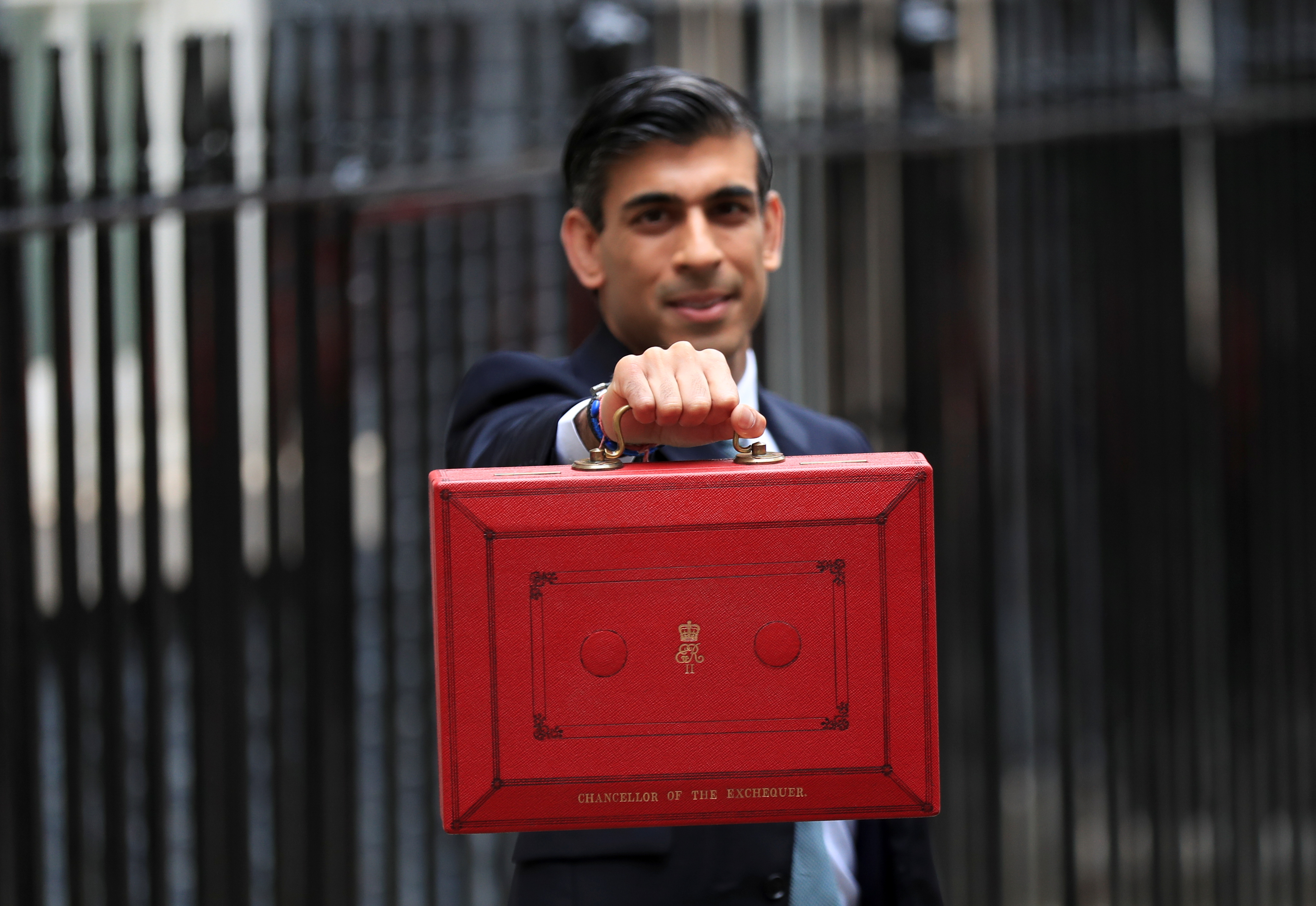Chancellor of the Exchequer Sunak holds the budget box outside Downing Street in London