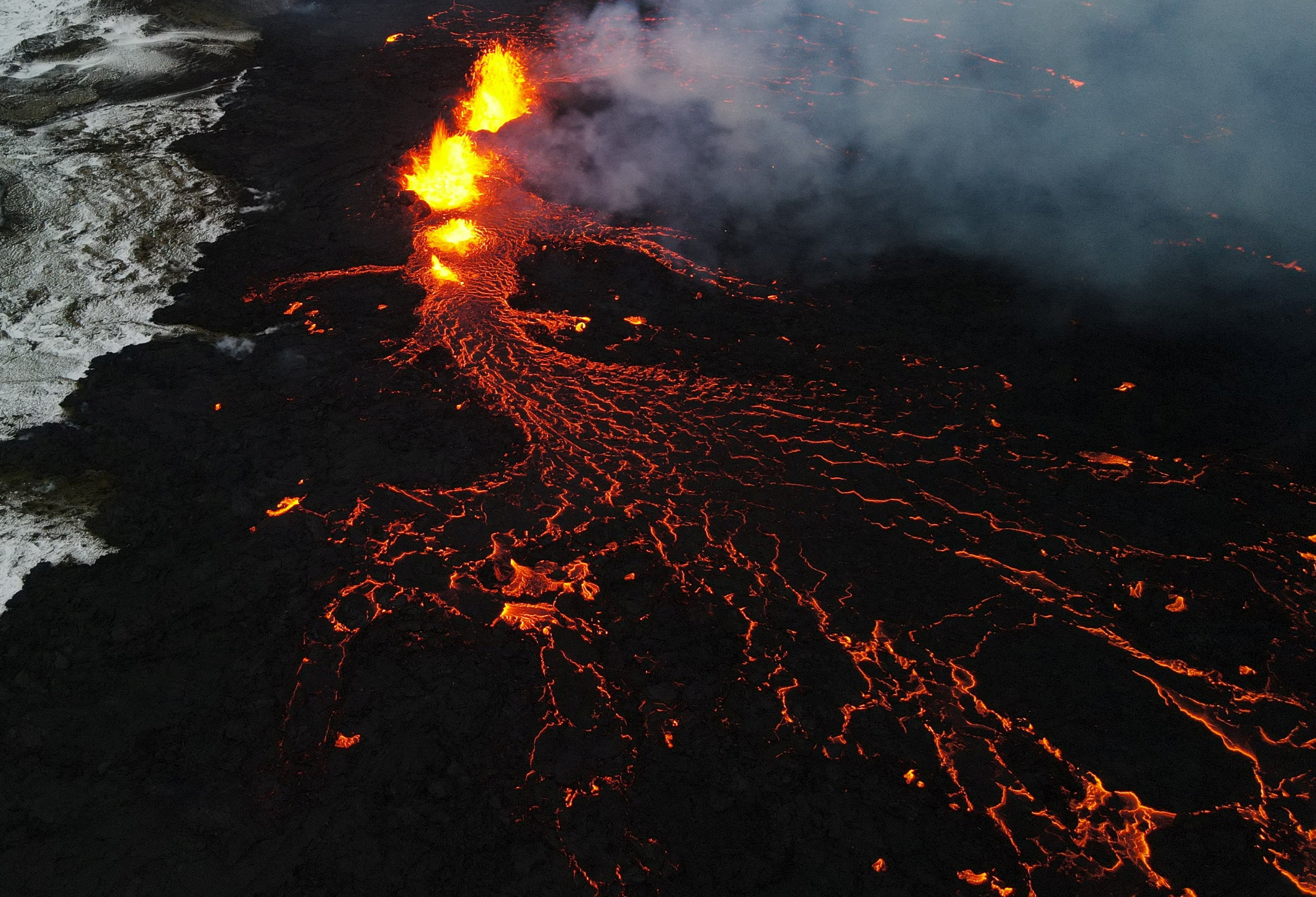 An aerial view of lava spewing from the site of the volcanic eruption north of Grindavik