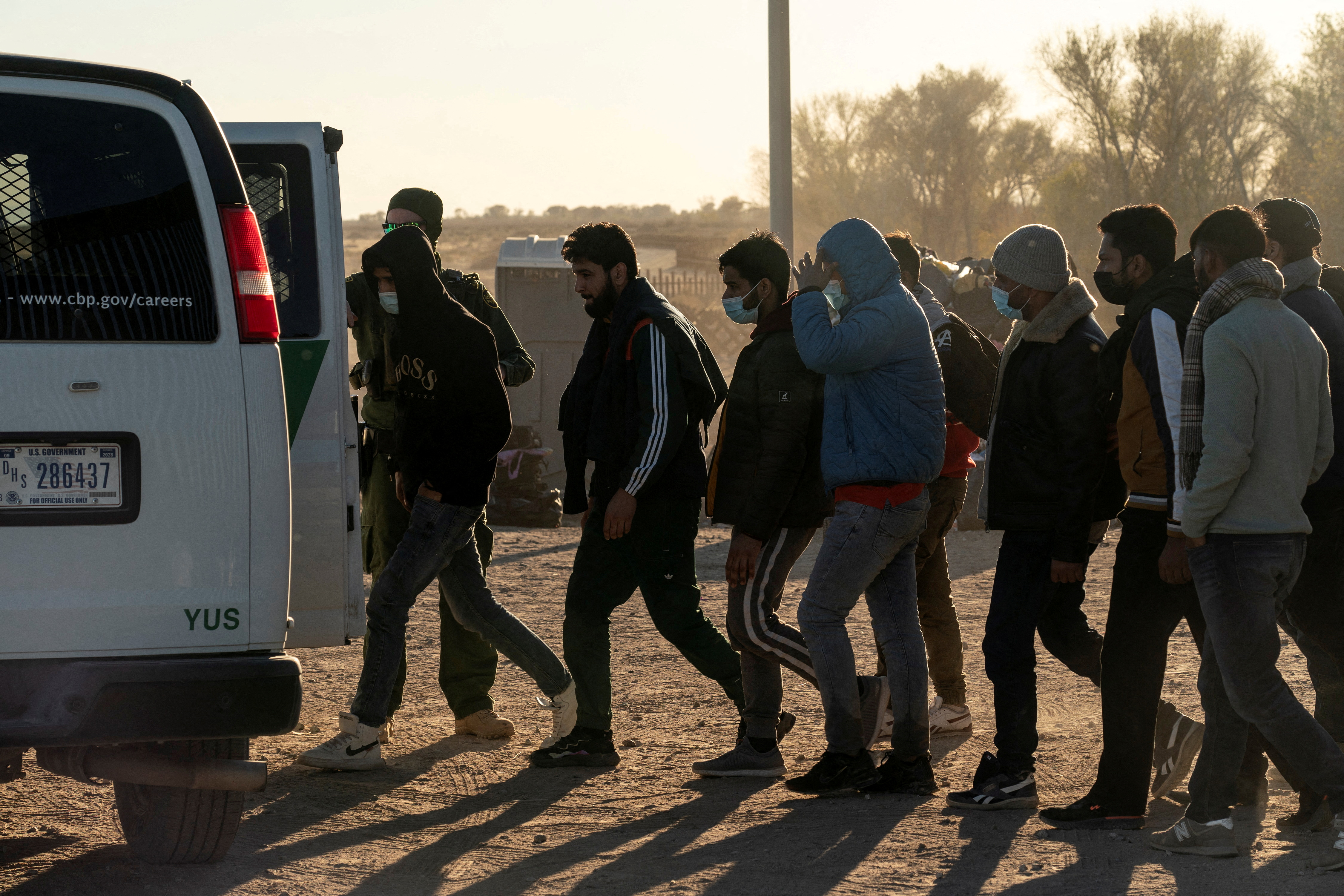 Migrants cross the border in Yuma, Arizona