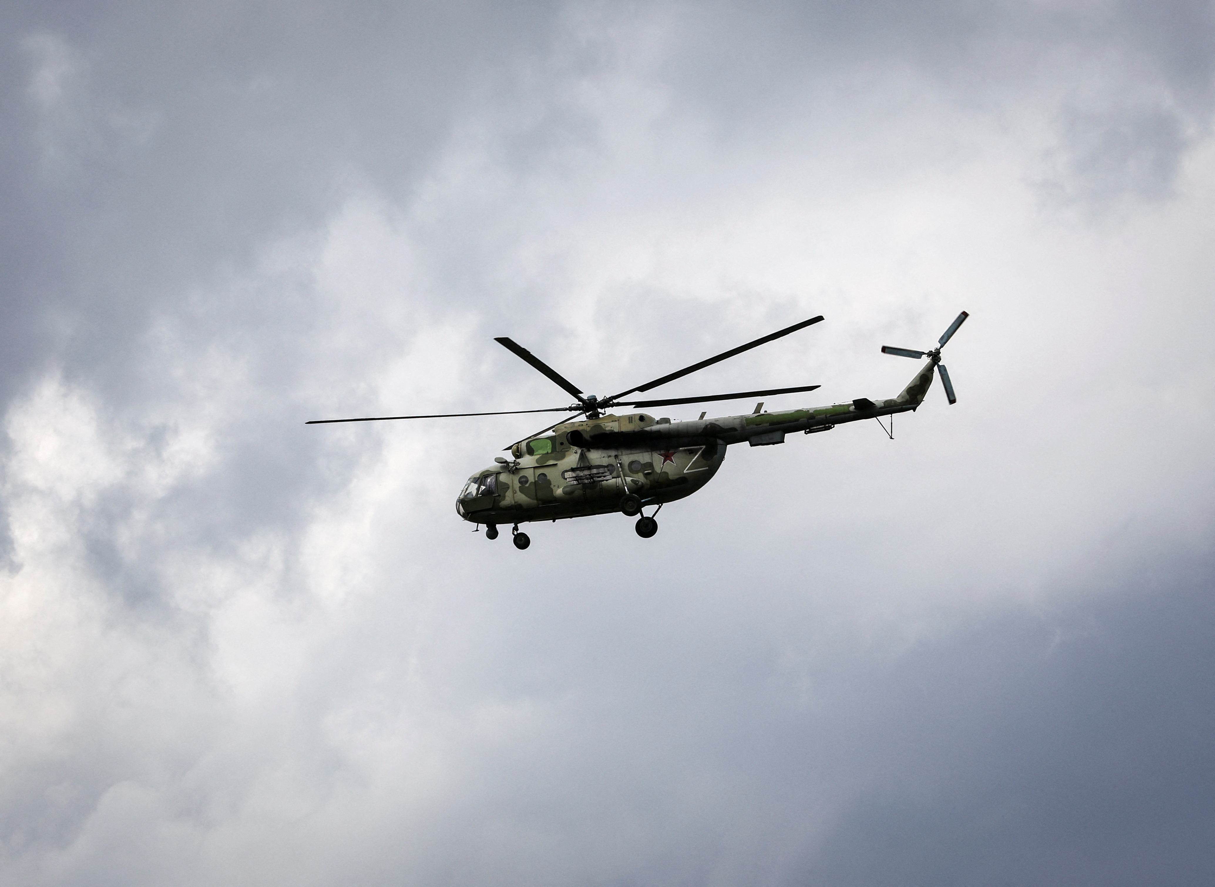 Russian army helicopter flies during Ukraine-Russia conflict over the town of Popasna