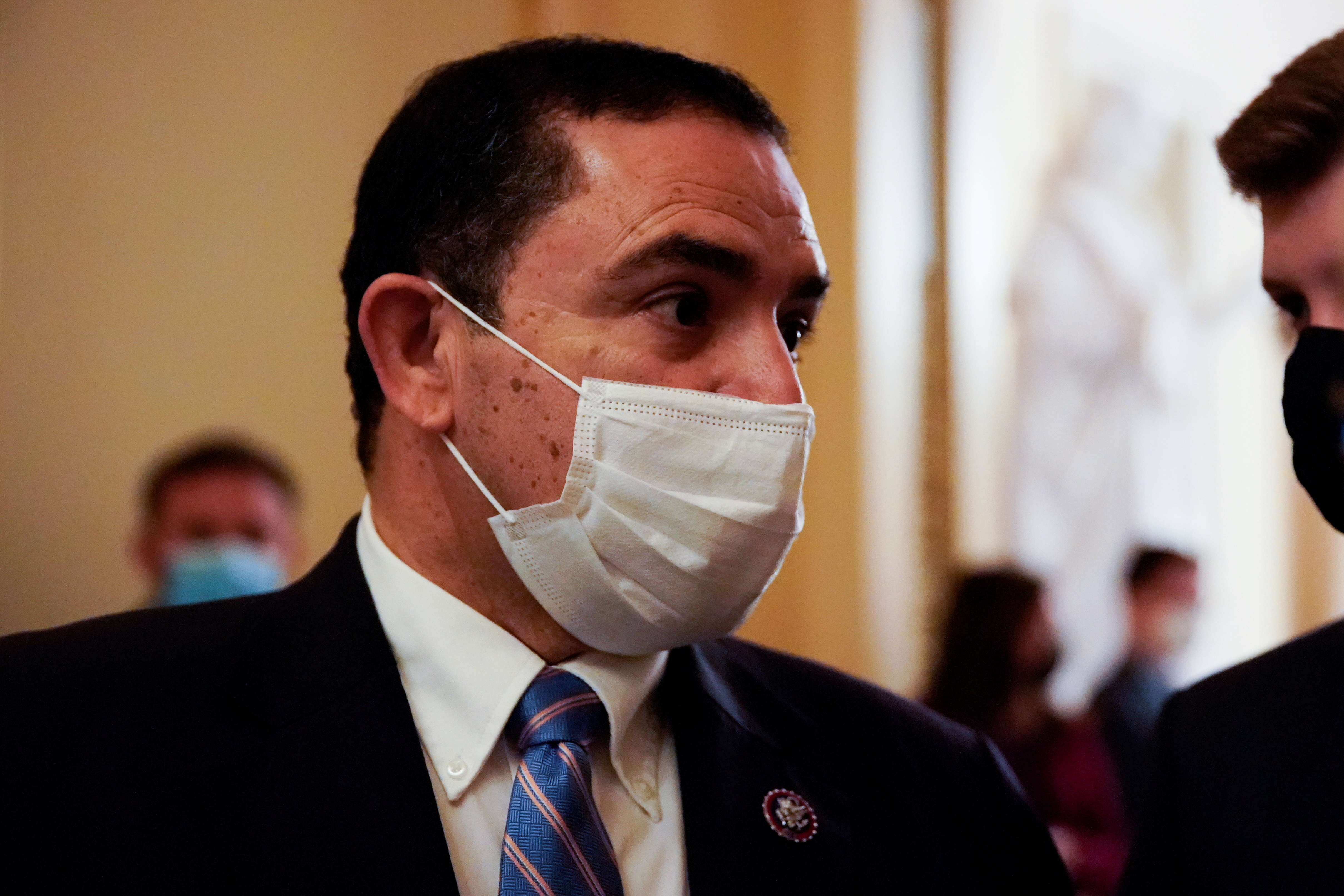 U.S. Representative Cuellar stops to talk to reporters on his way vote on the House floor at the U.S. Capitol in Washington