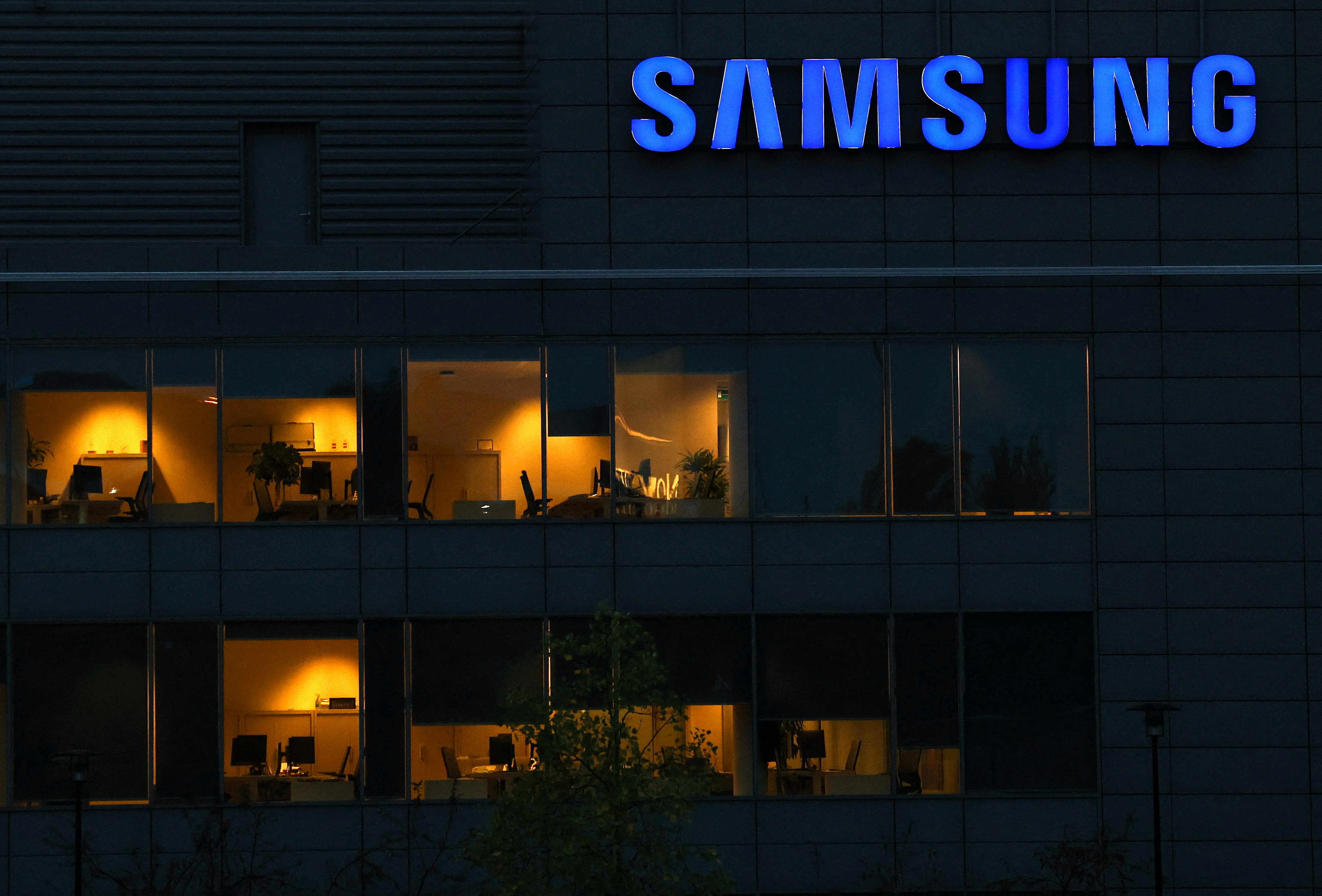 The logo of Samsung is seen on the top of a Brussels' office of the company in Diegem