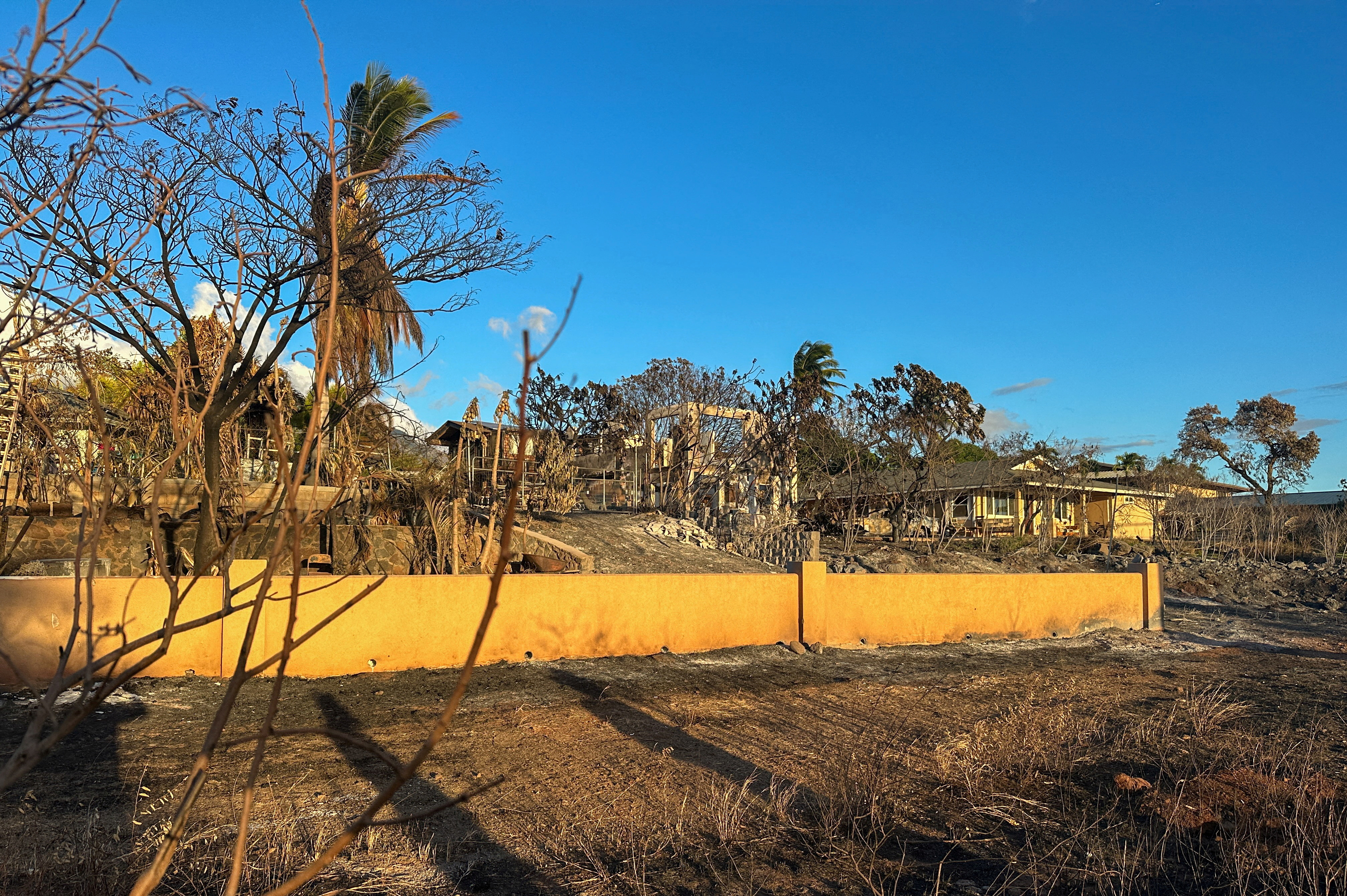 Homes damaged by fire are seenin Lahaina, Maui