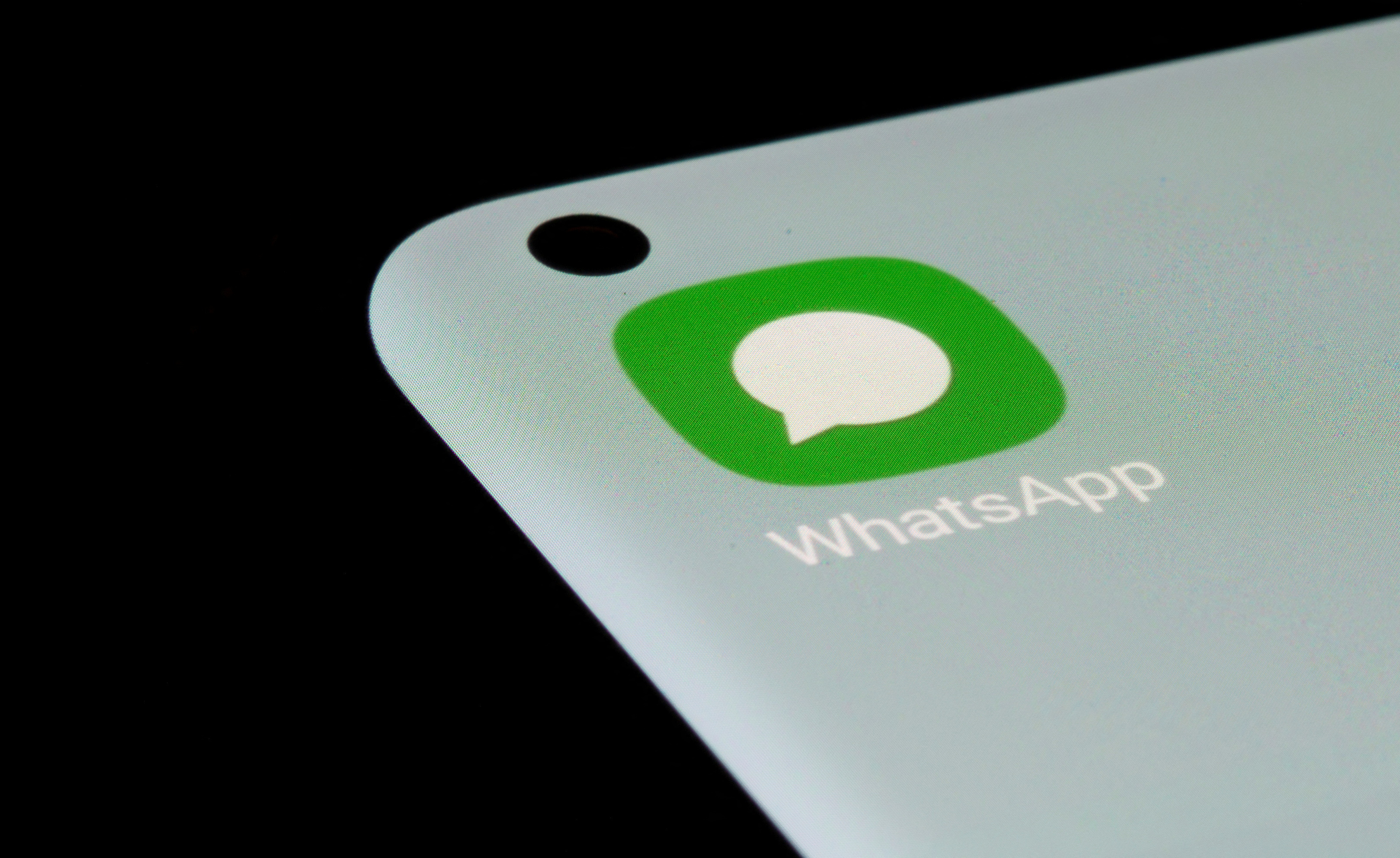 WhatsApp app is seen on a smartphone in this illustration
