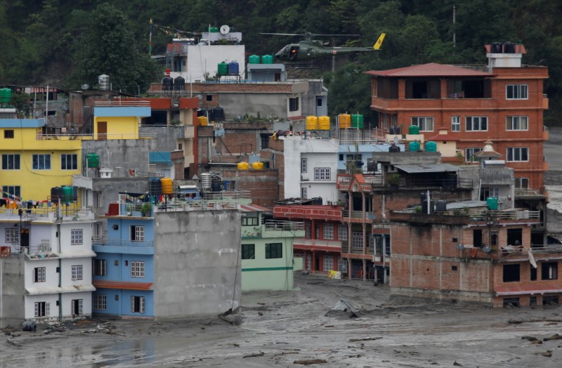 Flash floods kill 10 people in Bhutan, seven missing in Nepal | Reuters