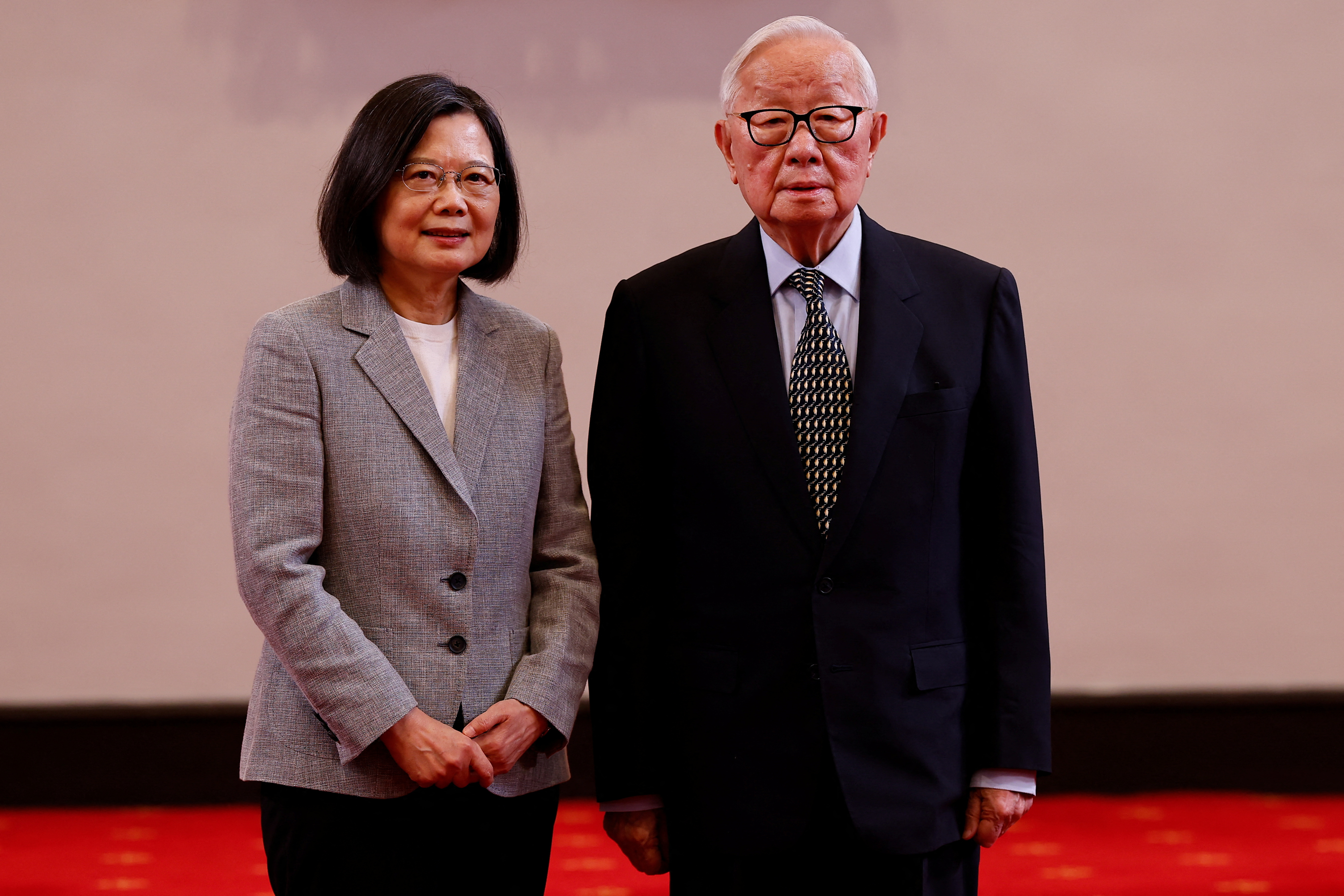 Taiwan's President Tsai Ing-wen poses for a photo with Taiwan's APEC representative and TSMC founder Morris Chang at a press conference in Taipei,