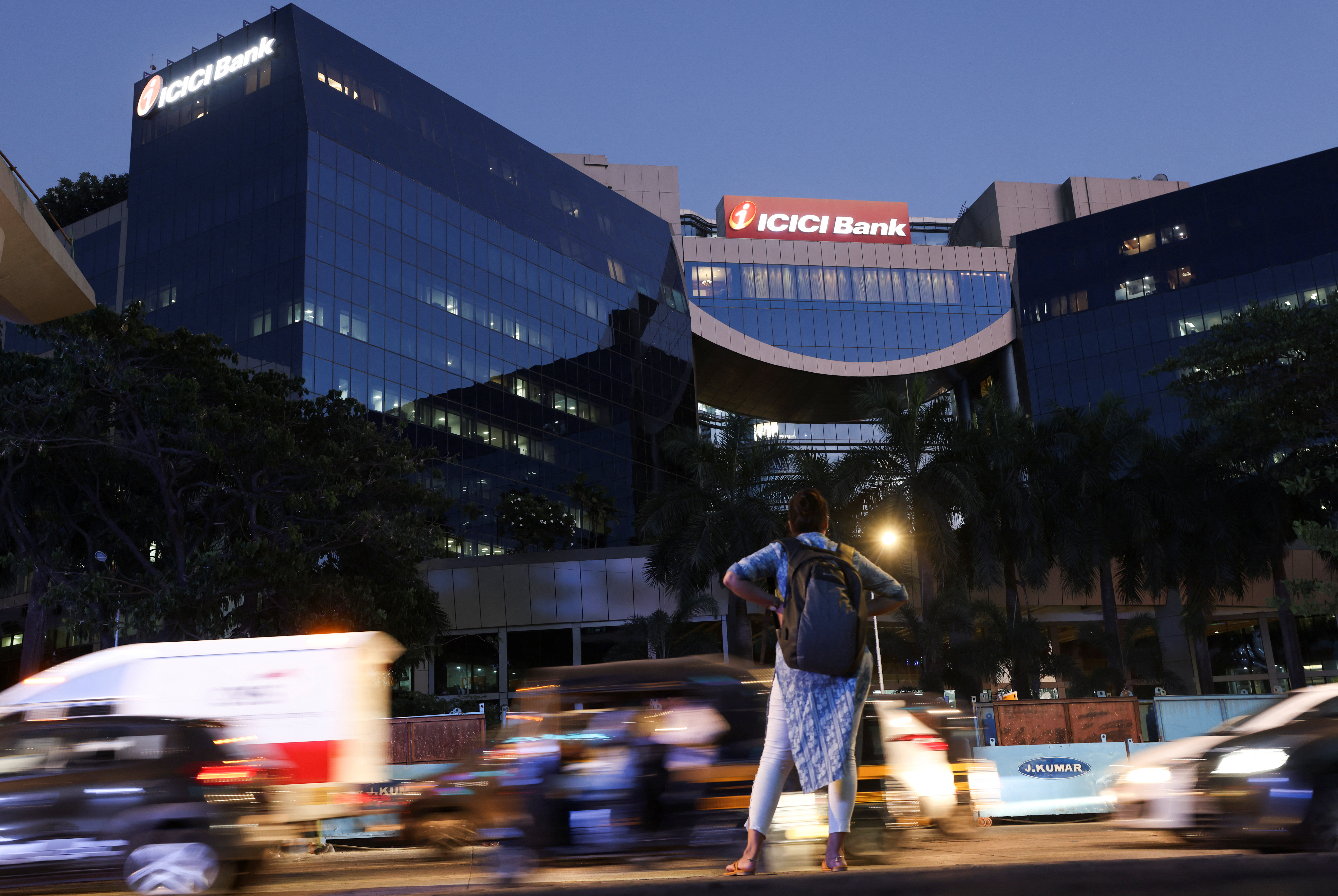 Traffic moves past the ICICI bank head office in Mumbai