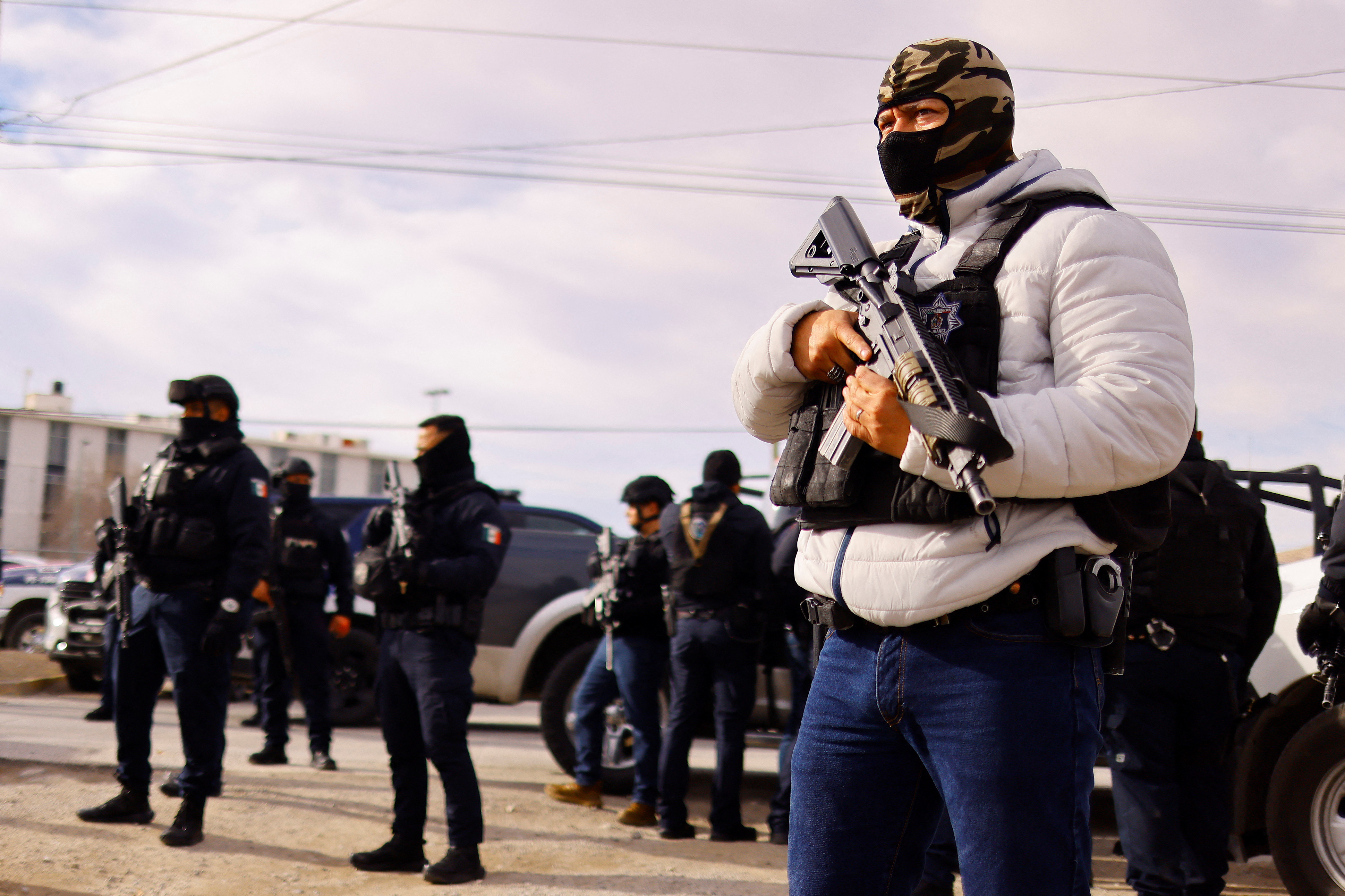 Security forces arrive to the Cereso number 3 state prison after unknown assailants entered the prison and freed several inmates, resulting in injuries and deaths, in Ciudad Juarez