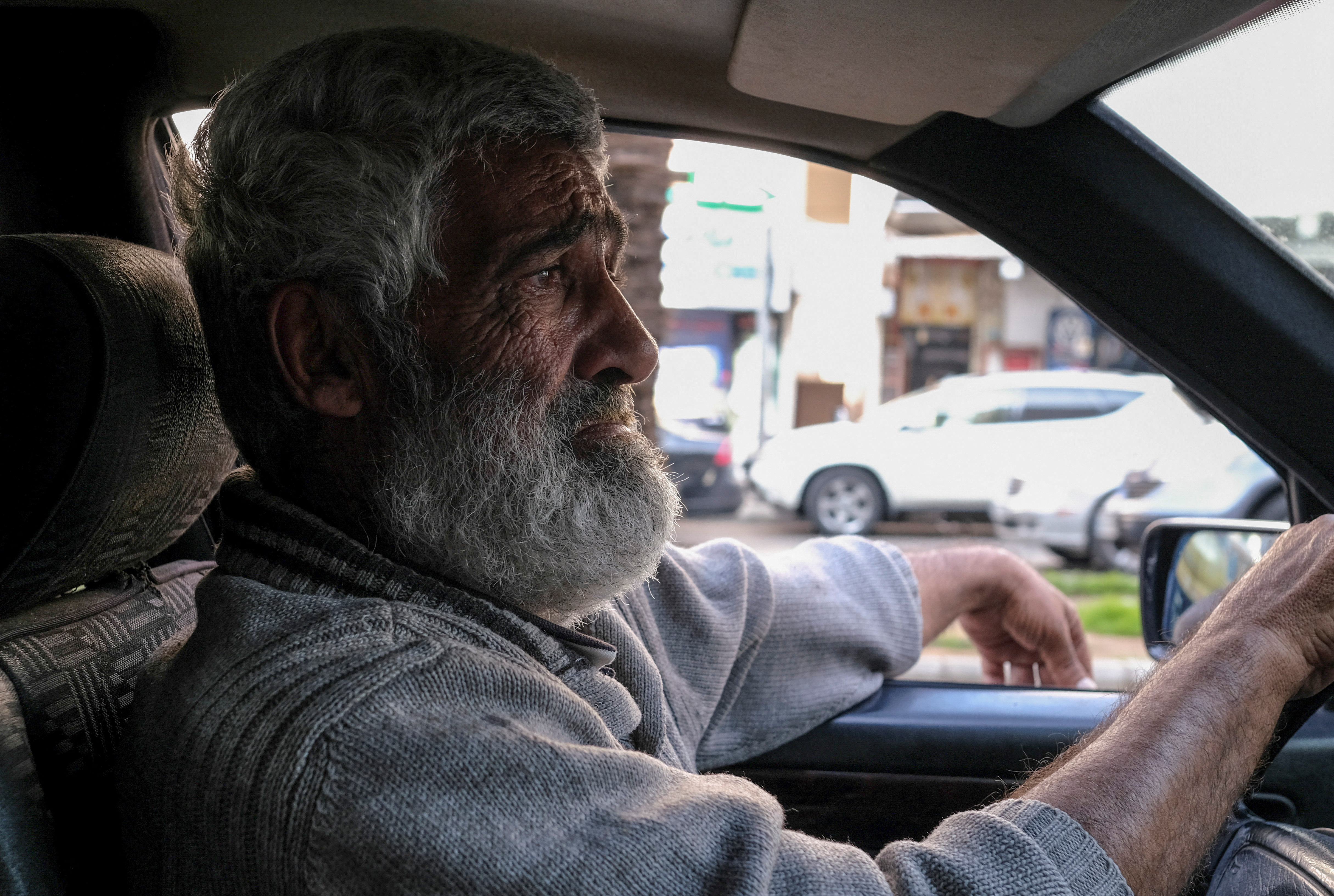 Cab driver Abed Omayraat, looks on during an interview with Reuters as he drives his cab in Beirut