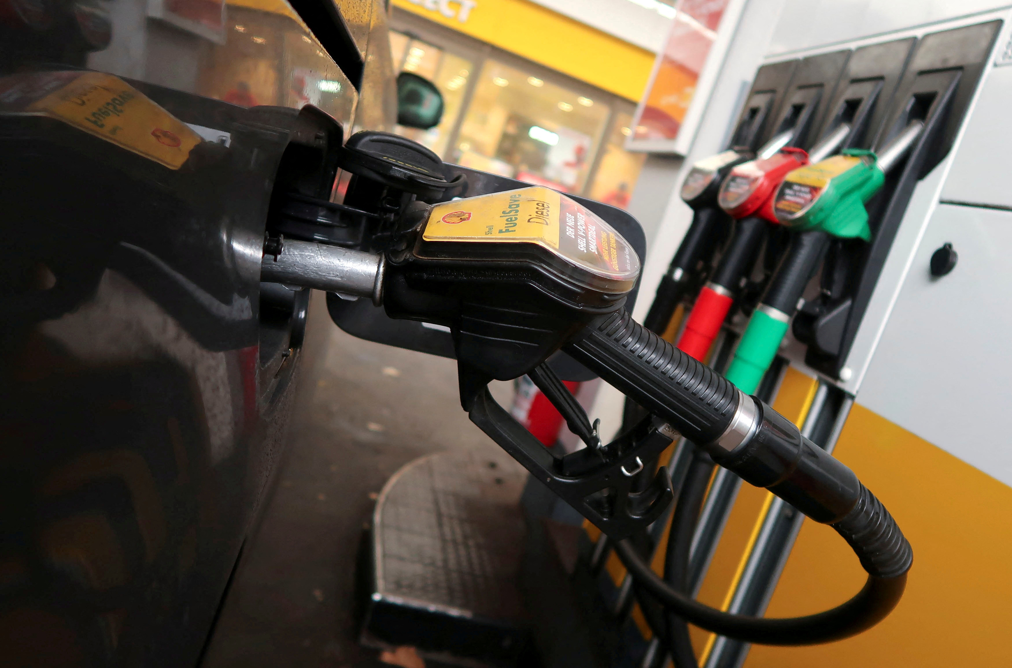 A diesel fuel nozzle is seen attached to a car at a Shell petrol station in Berlin