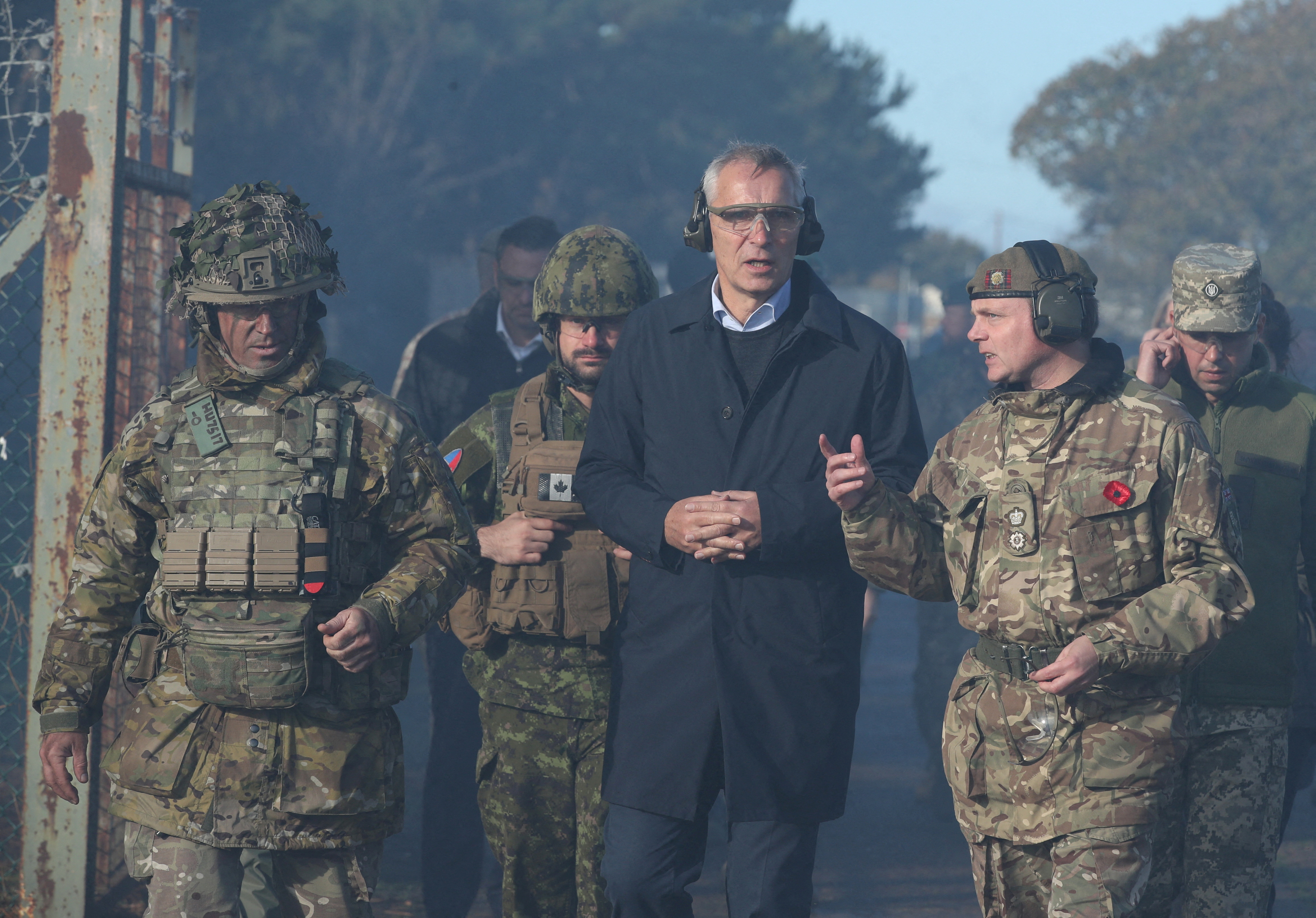 British defence minister hosts NATO chief at training camp for Ukrainian soldiers