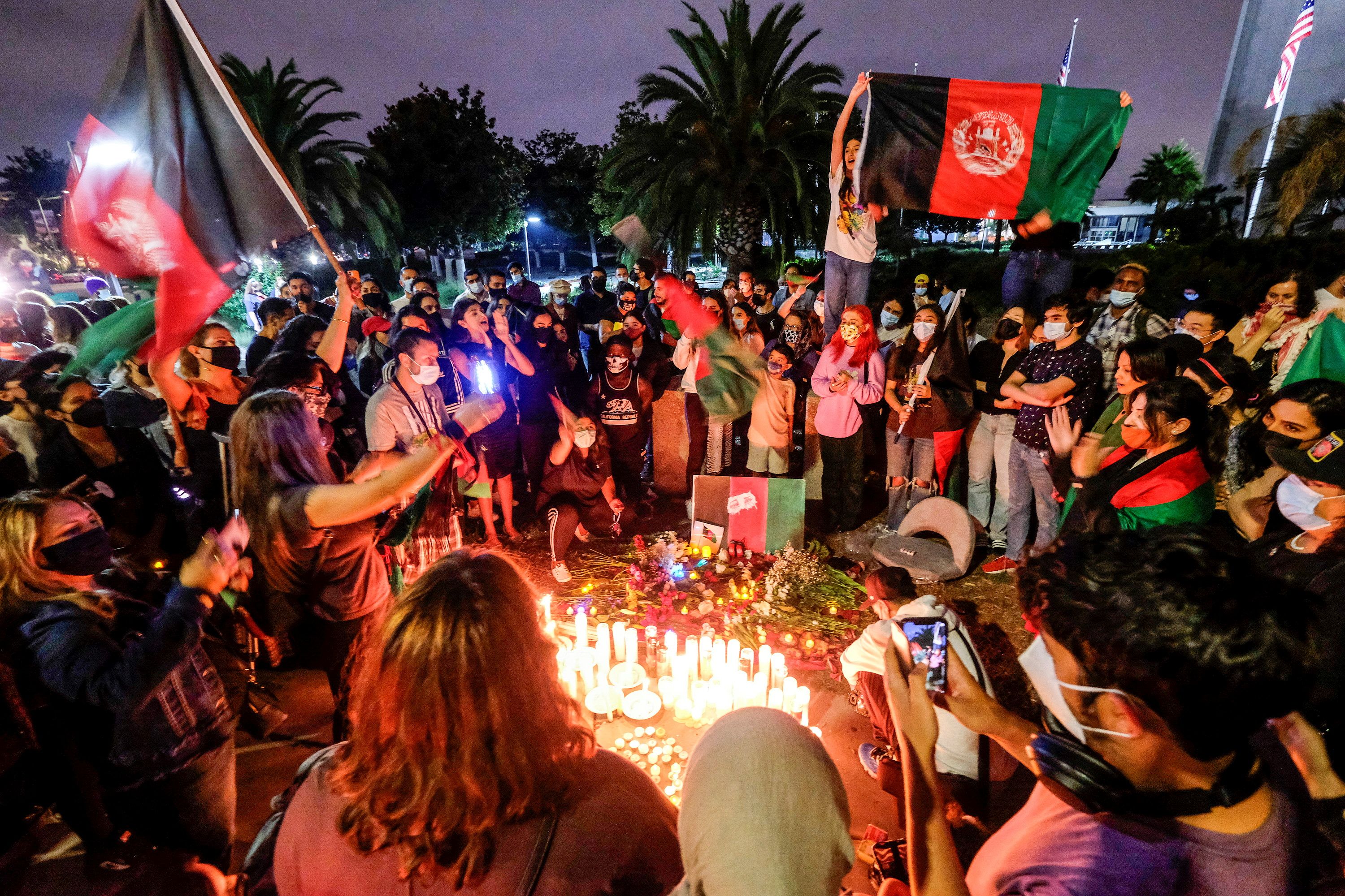 People attend a vigil for Afghanistan outside the West LA Federal Building in Los Angeles, California, U.S. August 17, 2021.  REUTERS/Ringo Chiu
