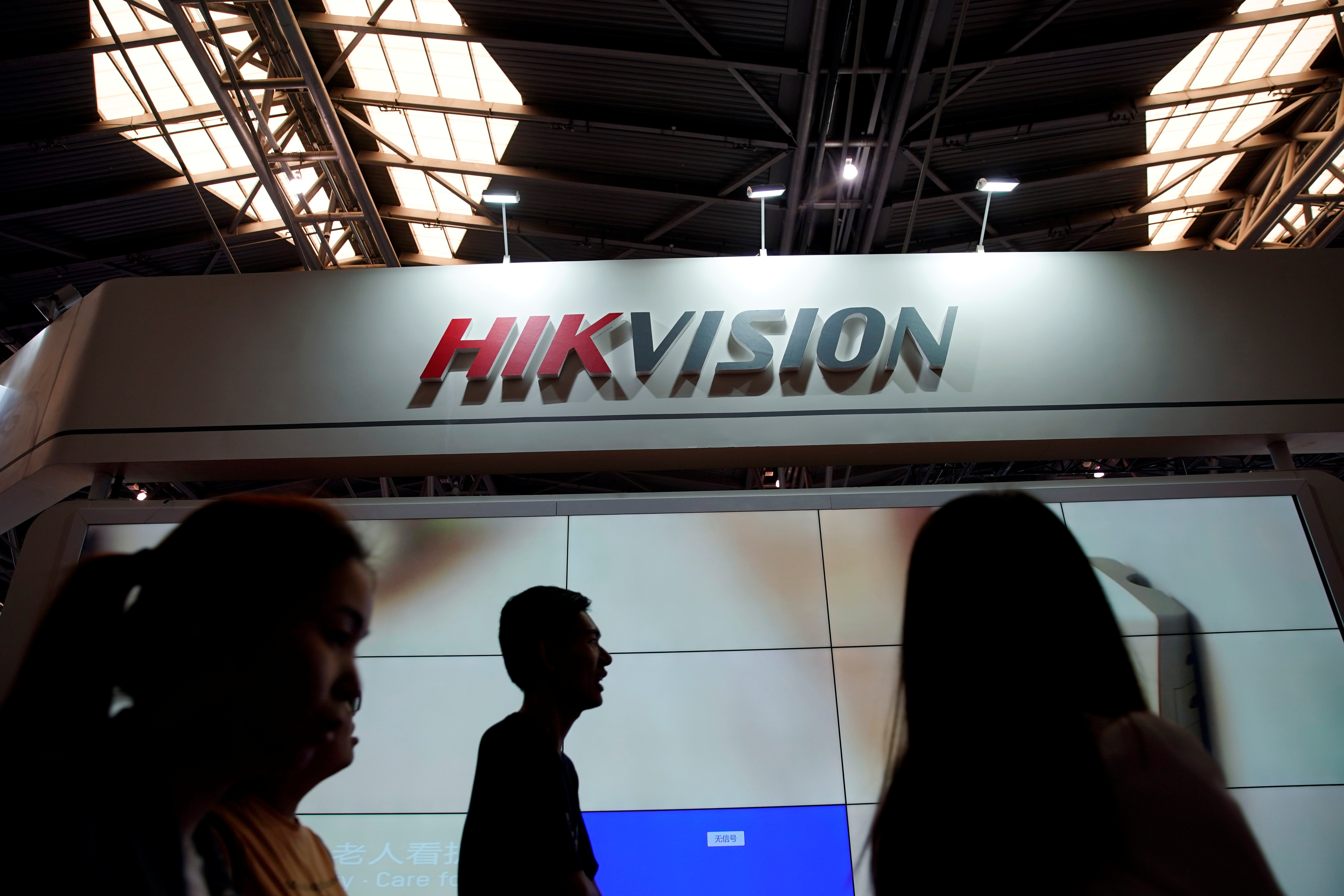 People visit a HIKVision booth at the security exhibition in Shanghai