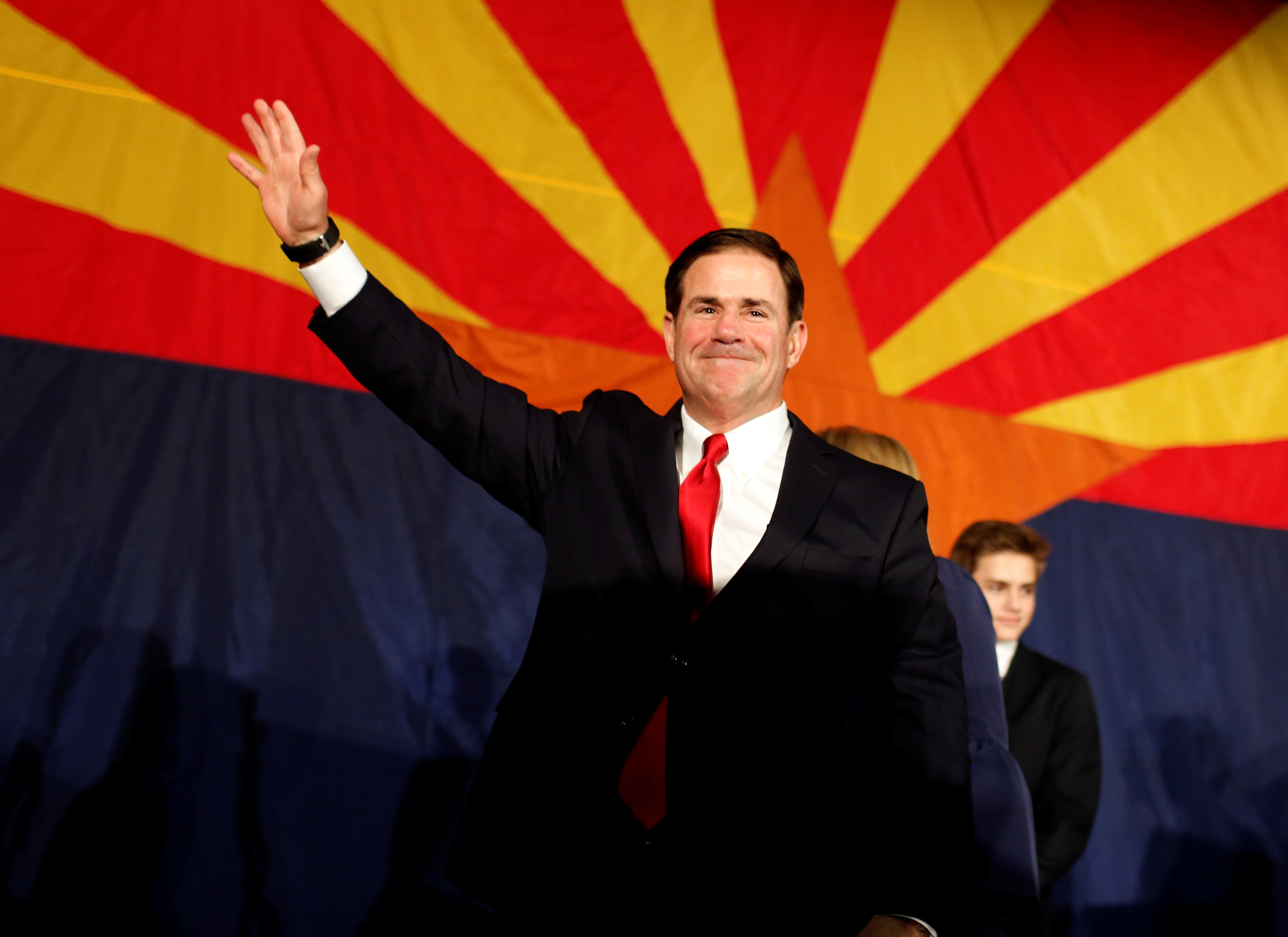 Arizona Gov. Doug Ducey greets the GOP midterm elections watch party after being re-elected in Phoenix, Arizona