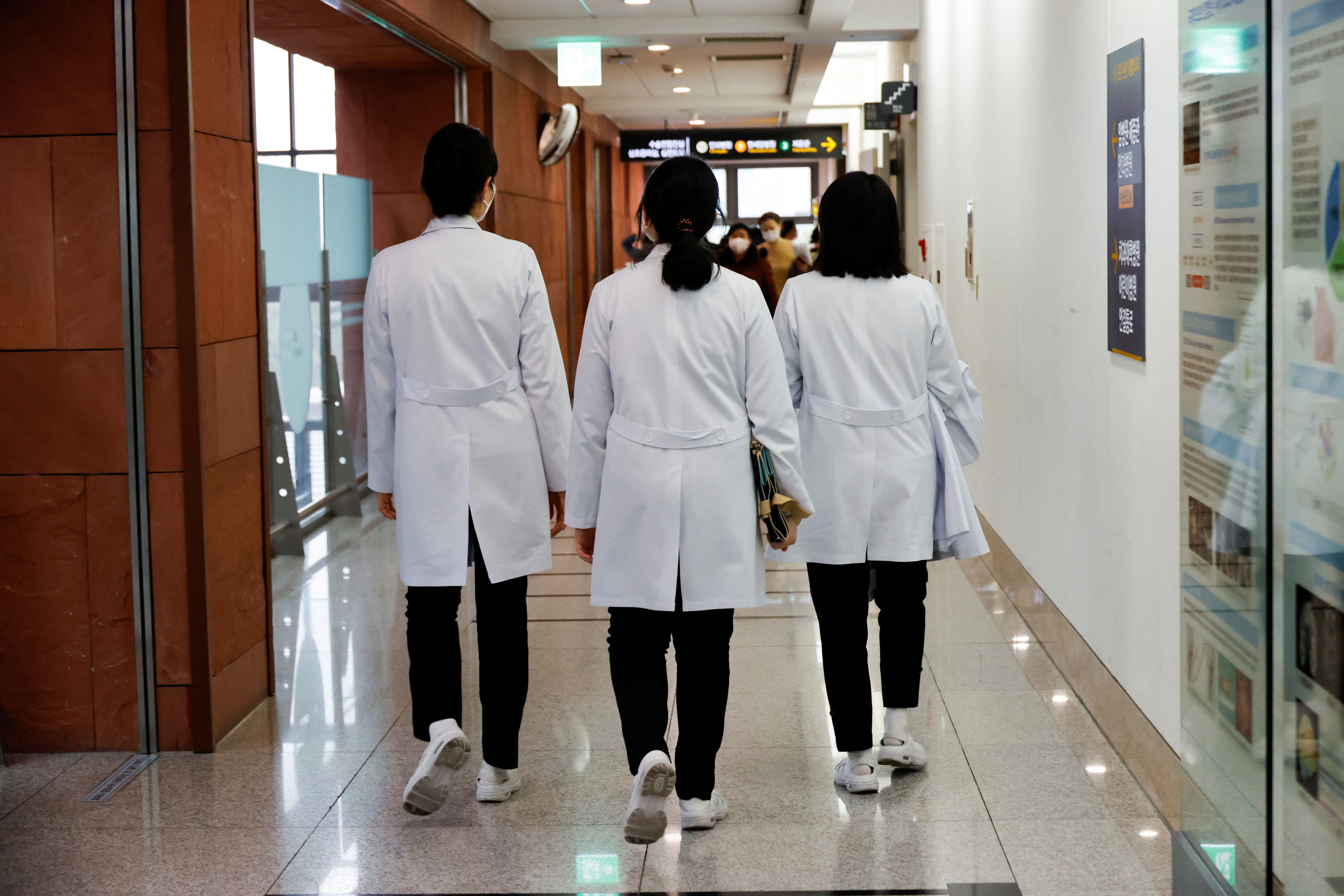 fMedical workers walk at Severance Hospital in Seoul