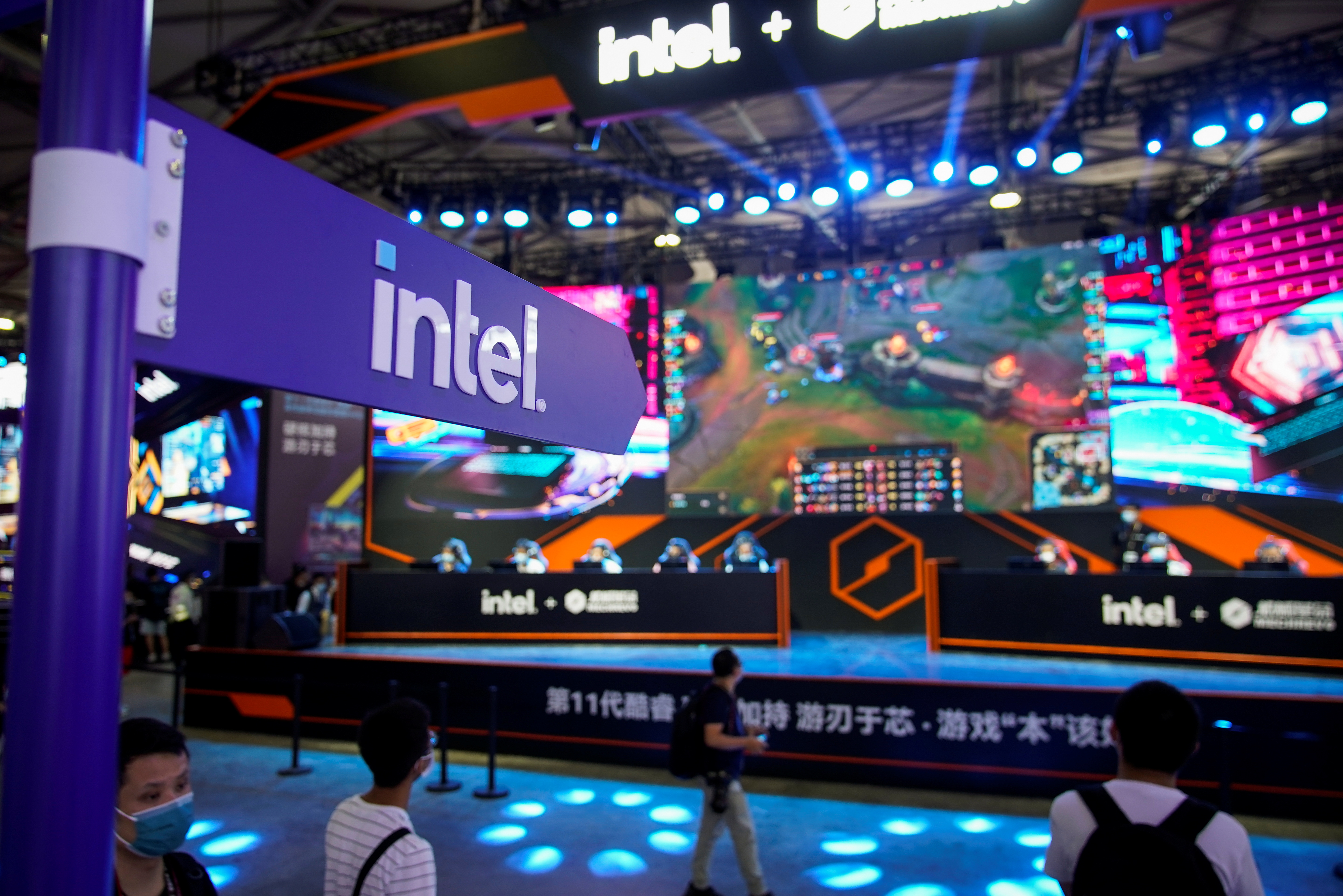 Visitors are seen at the Intel booth during the China Digital Entertainment Expo and Conference, also known as ChinaJoy, in Shanghai, China July 30, 2021. REUTERS/Aly Song