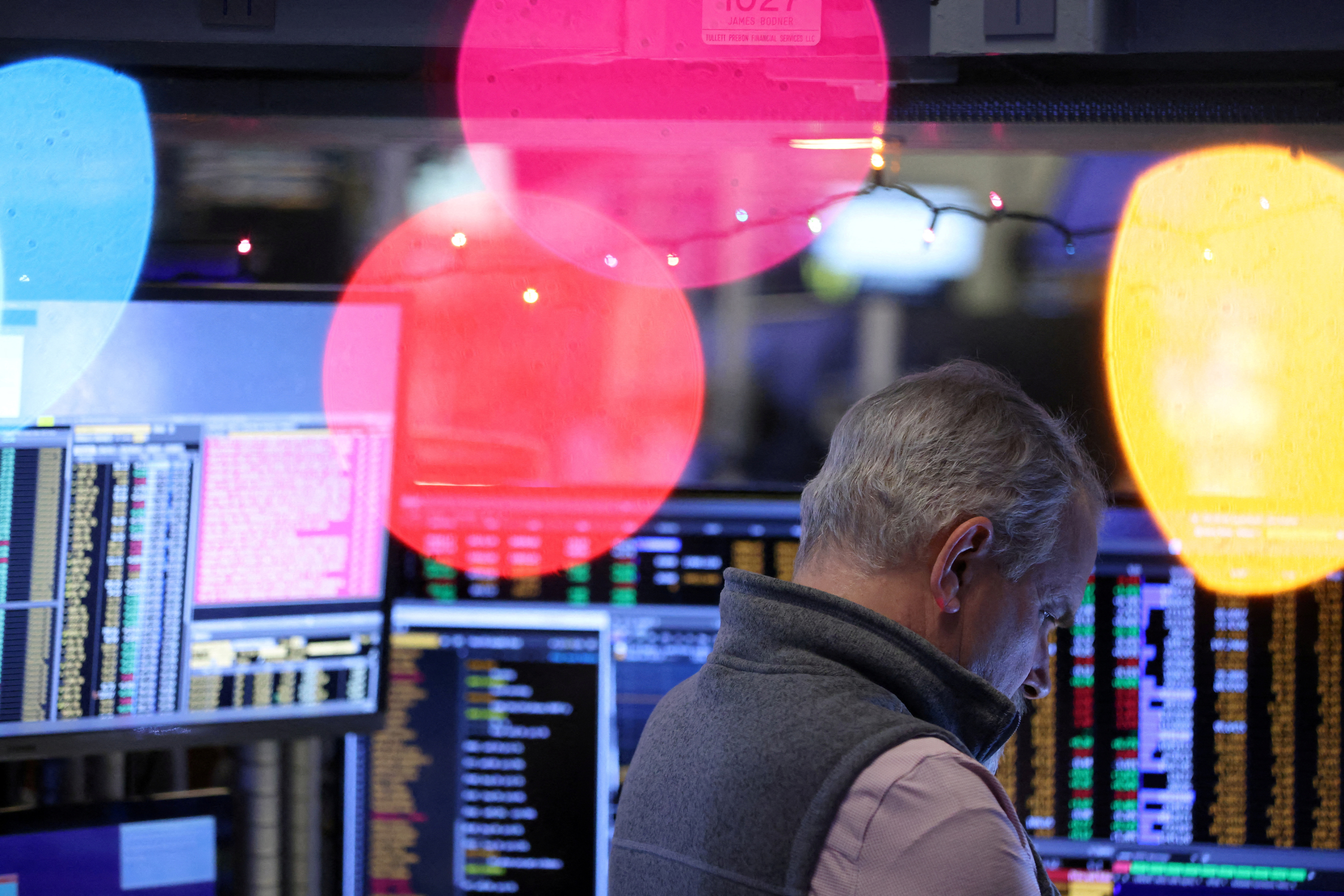 A trader works on the trading floor at the New York Stock Exchange (NYSE) in New York City