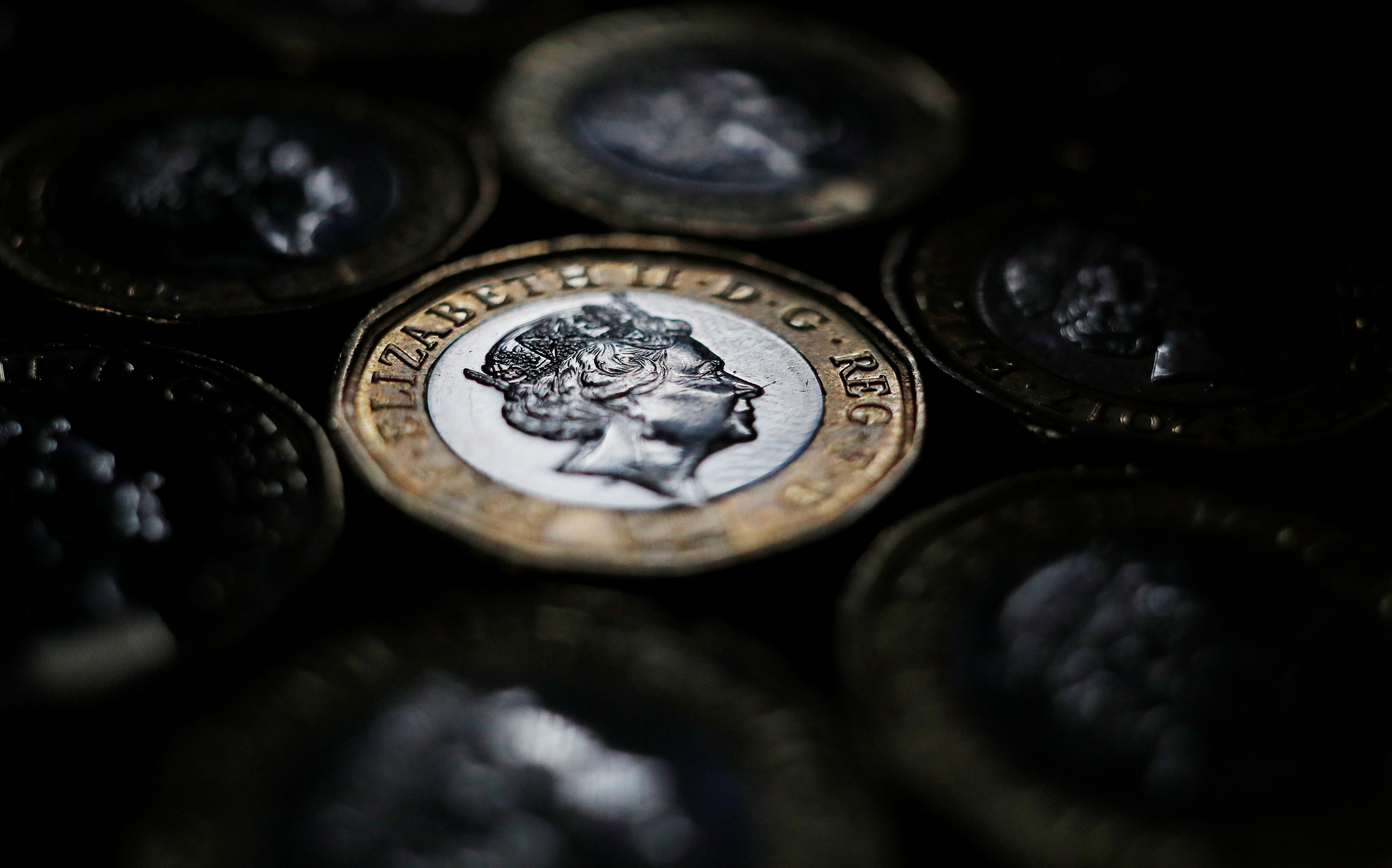 Pound coins are seen in the photo illustration taken in Manchester, Britain September 6, 2017. REUTERS/Phil Noble/Illustration