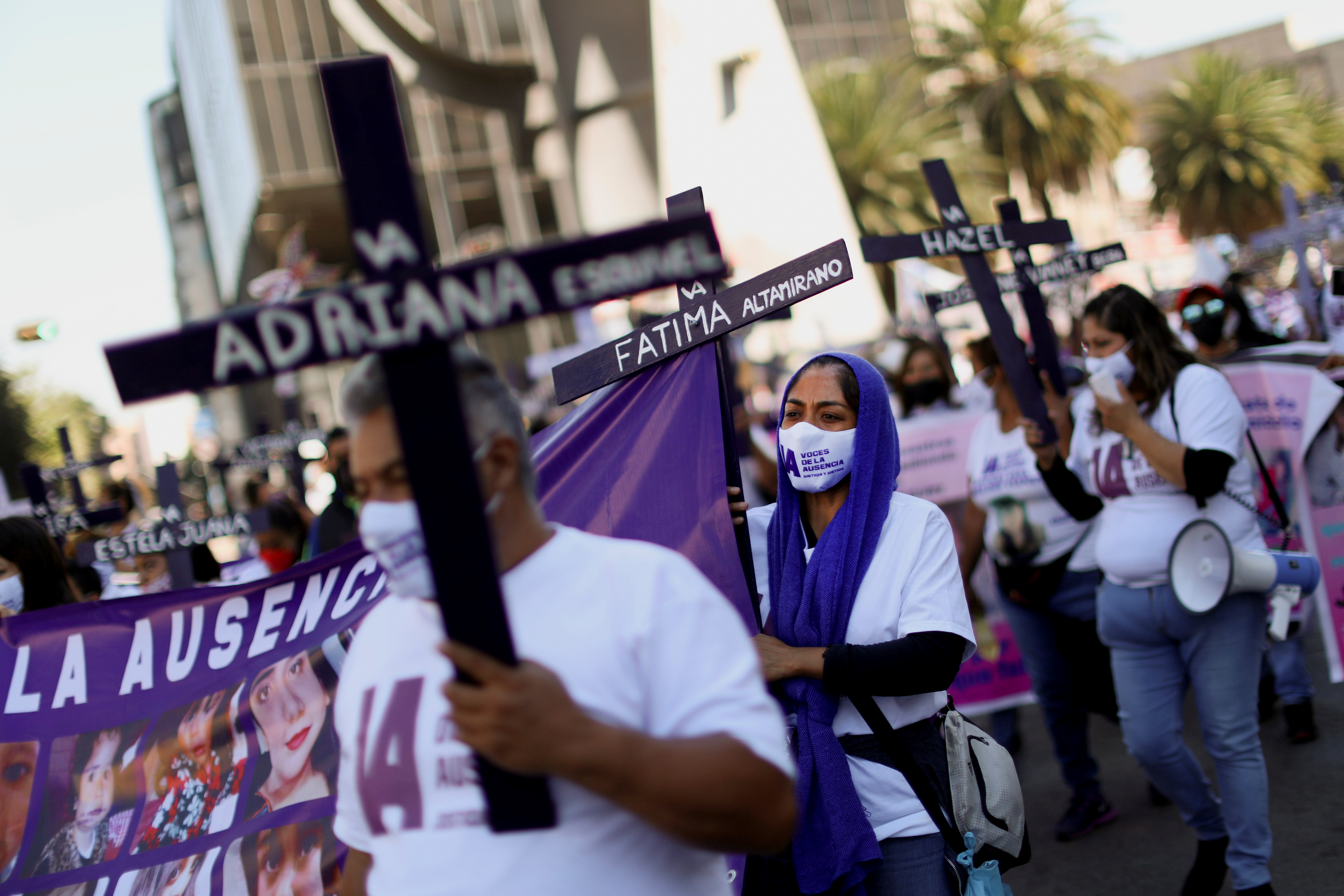 Clutching graveyard crosses, hundreds protest violence against women in  Mexico | Reuters
