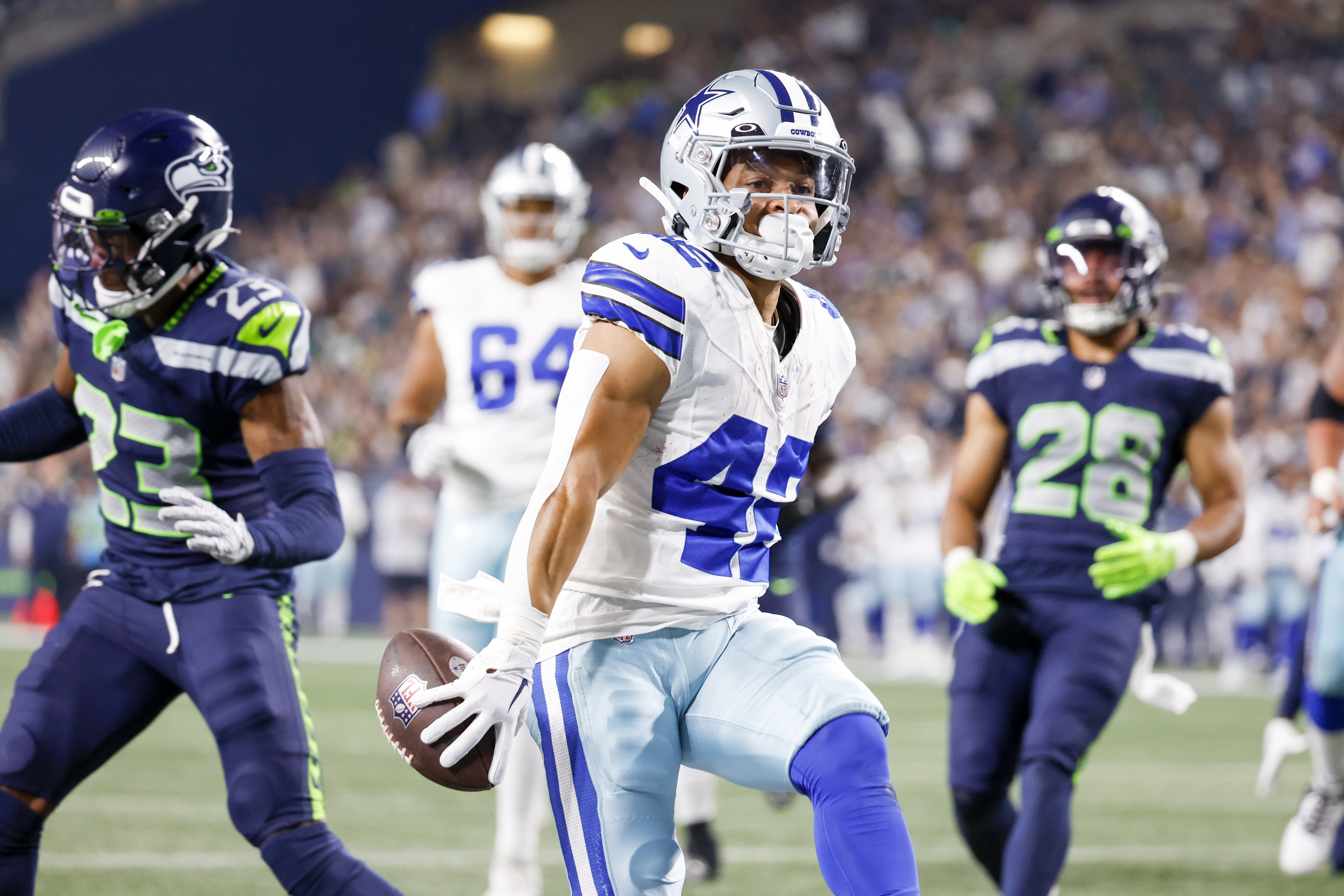 Dallas Cowboys running back Rico Dowdle (23) runs the ball against the  Seattle Seahawks during a preseason NFL football game, Saturday, Aug. 19,  2023, in Seattle. (AP Photo/Lindsey Wasson Stock Photo - Alamy