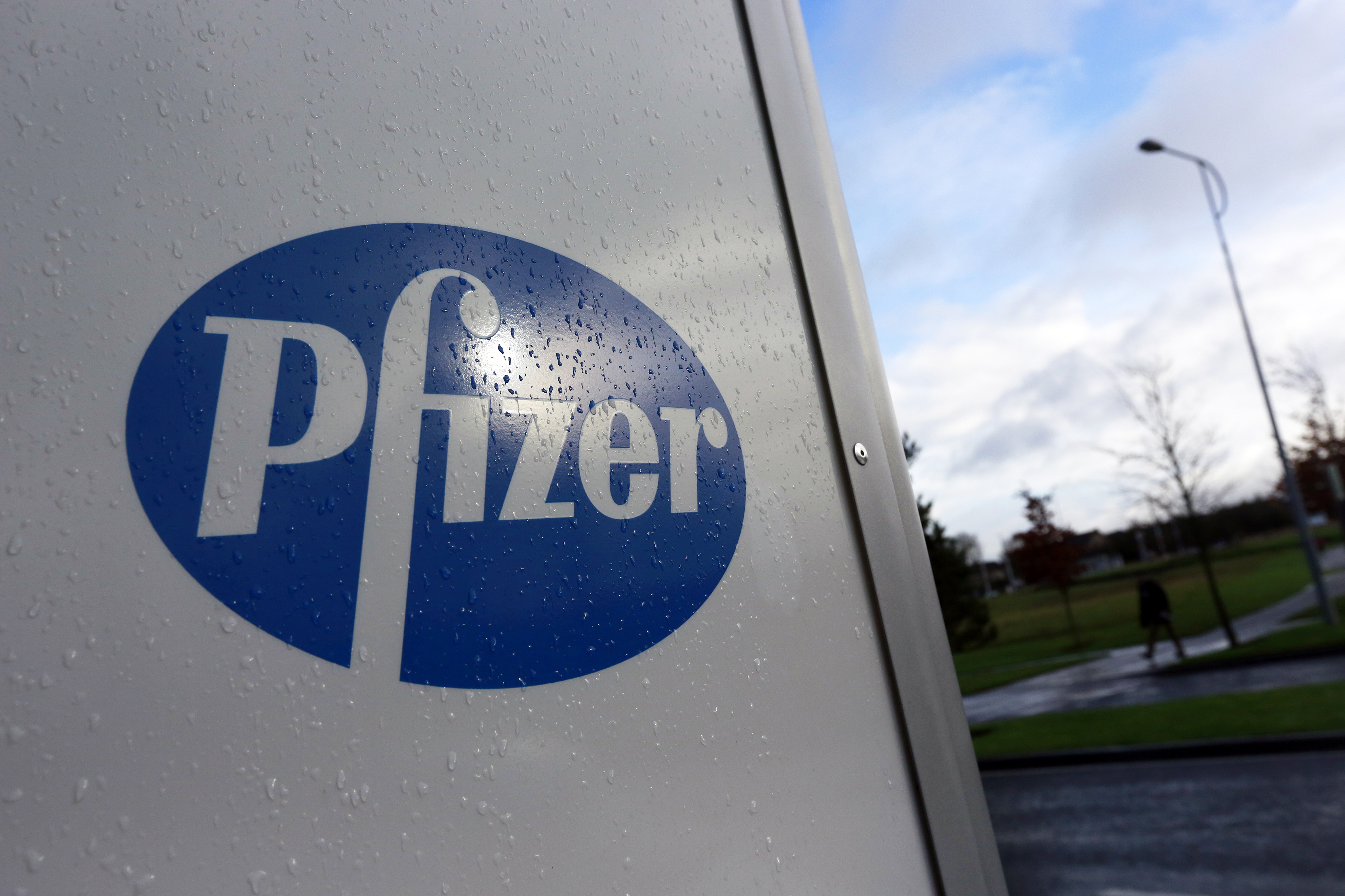 A company logo is seen at a Pfizer office in Dublin