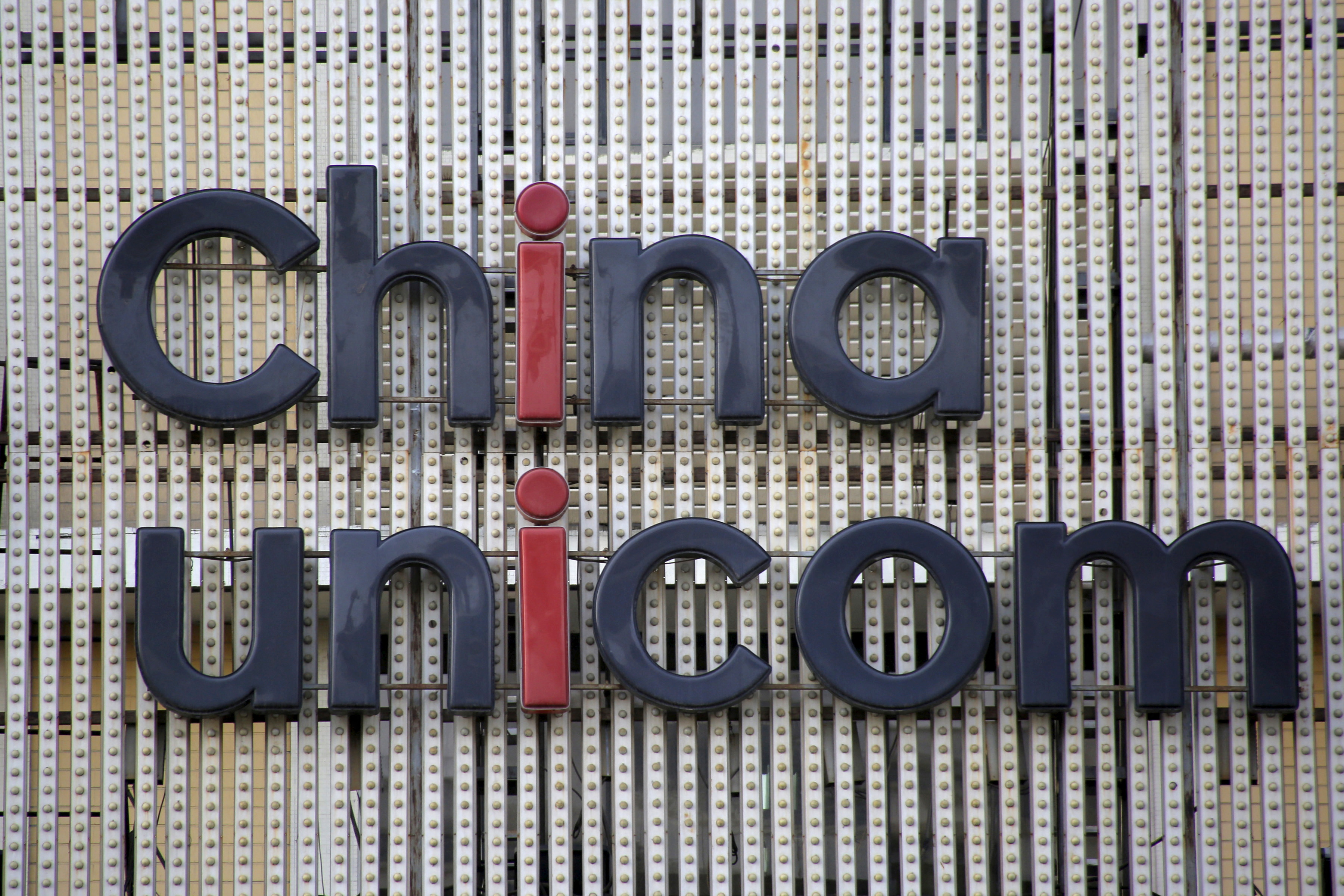 China Unicom's company logo is seen at its branch office in Beijing, China, April 21, 2016.REUTERS/Kim Kyung-Hoon/File Photo             GLOBAL BUSINESS WEEK AHEAD PACKAGE    SEARCH BUSINESS WEEK AHEAD 17 OCT FOR ALL IMAGES
