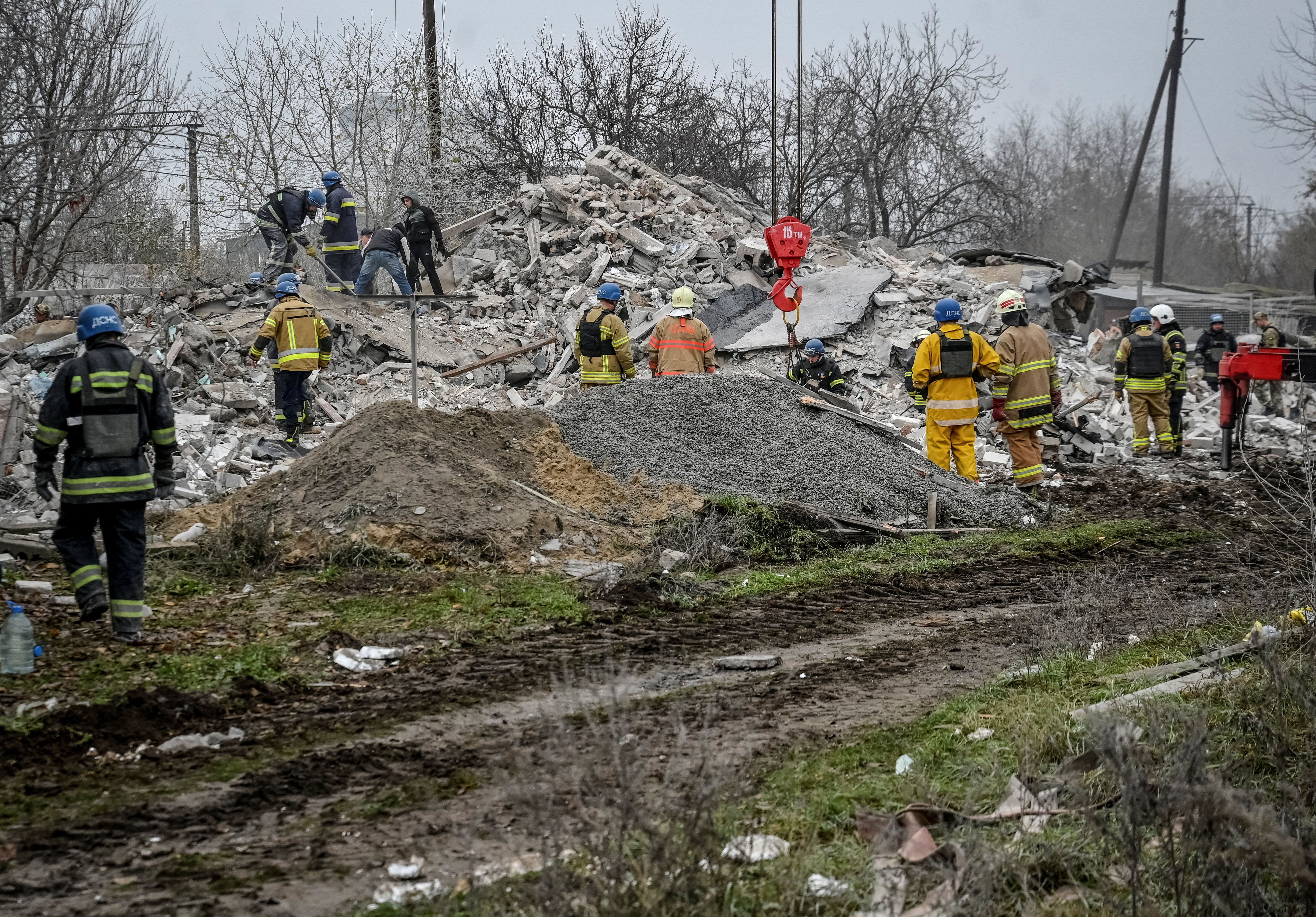 Rescuers work at a site of a residential building destroyed by a Russian missile strike in the town of Vilniansk