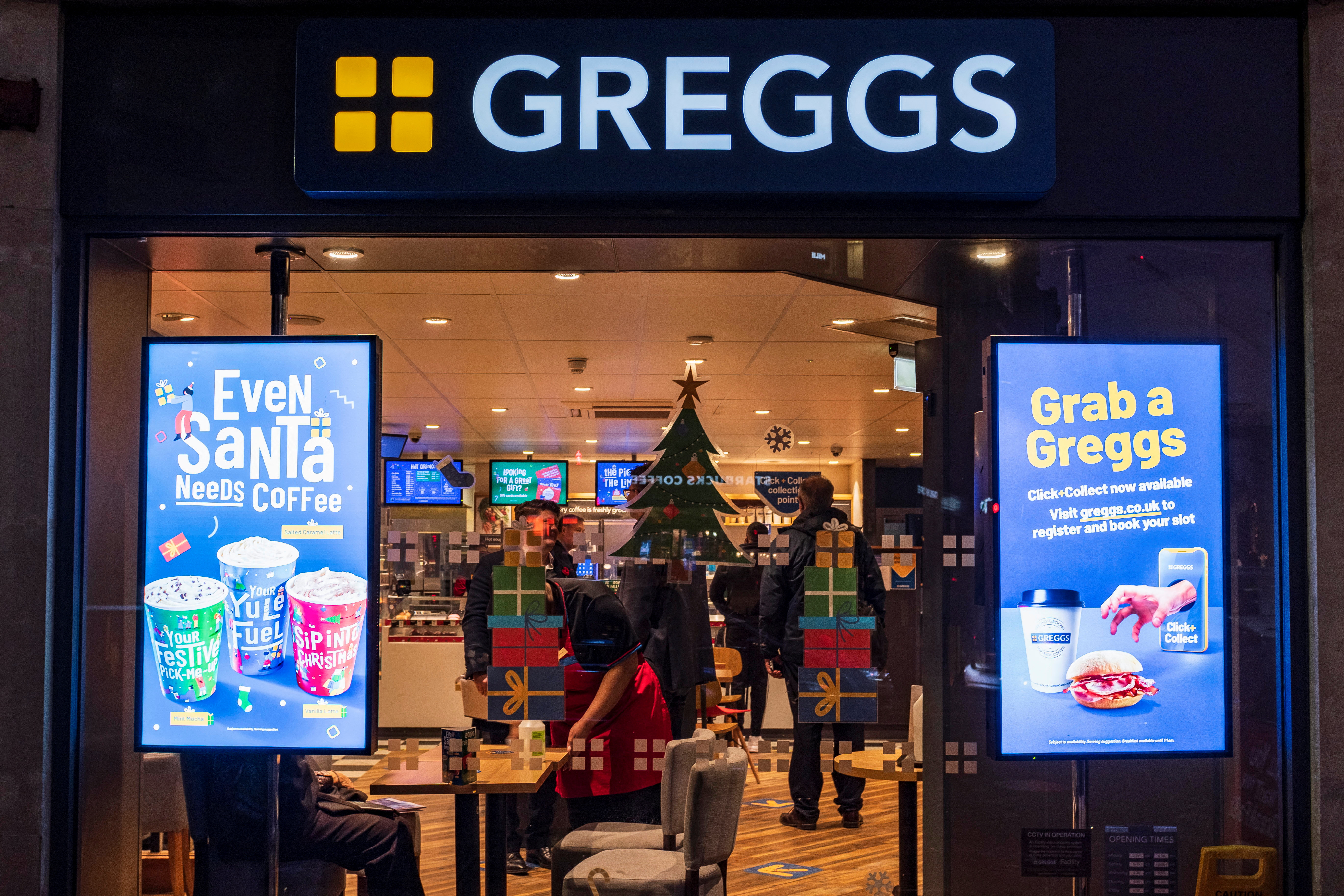 A Christmas themed window display at a branch of Greggs in London