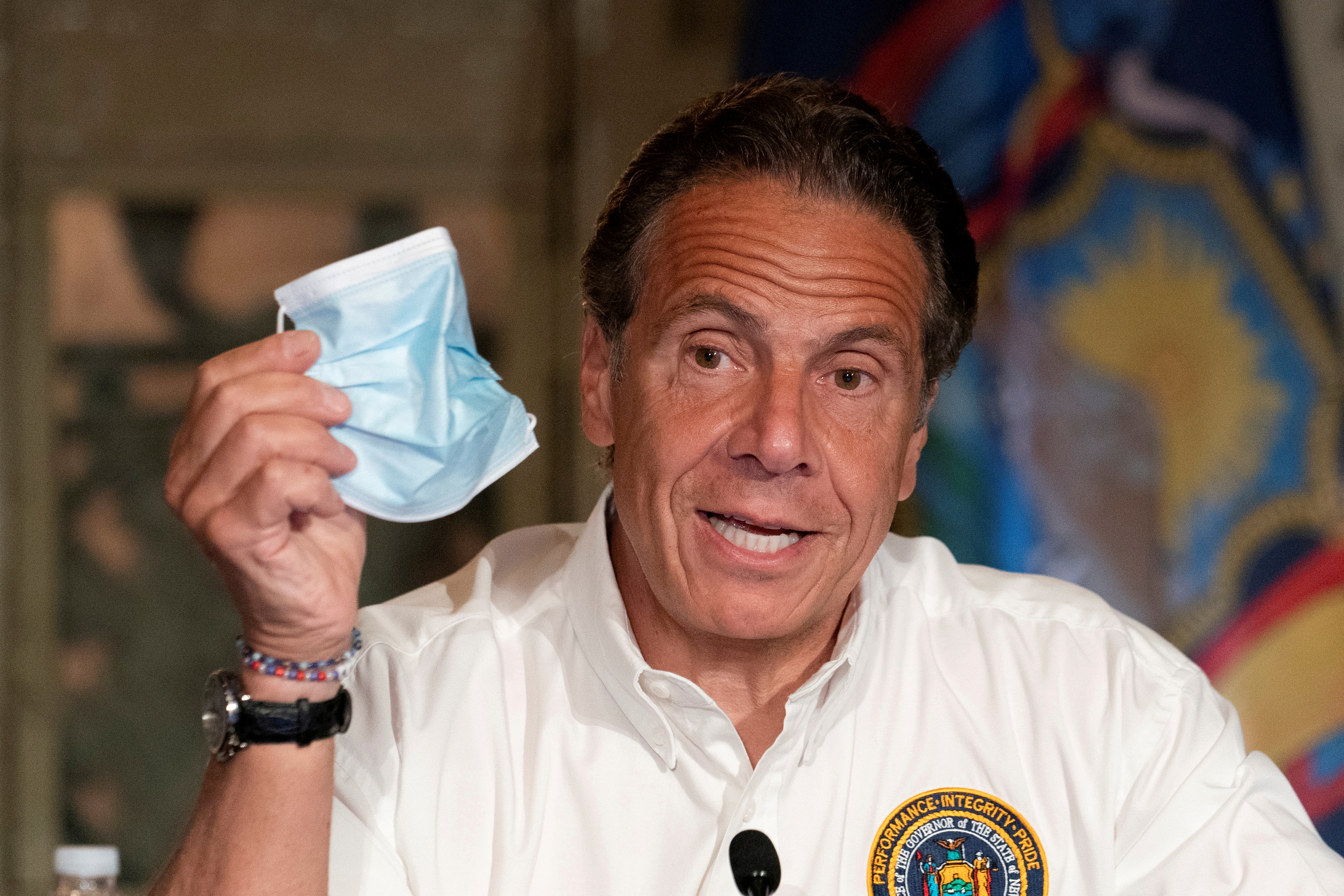 New York Governor Andrew Cuomo discusses the wearing of masks as he speaks at a news conference in New York