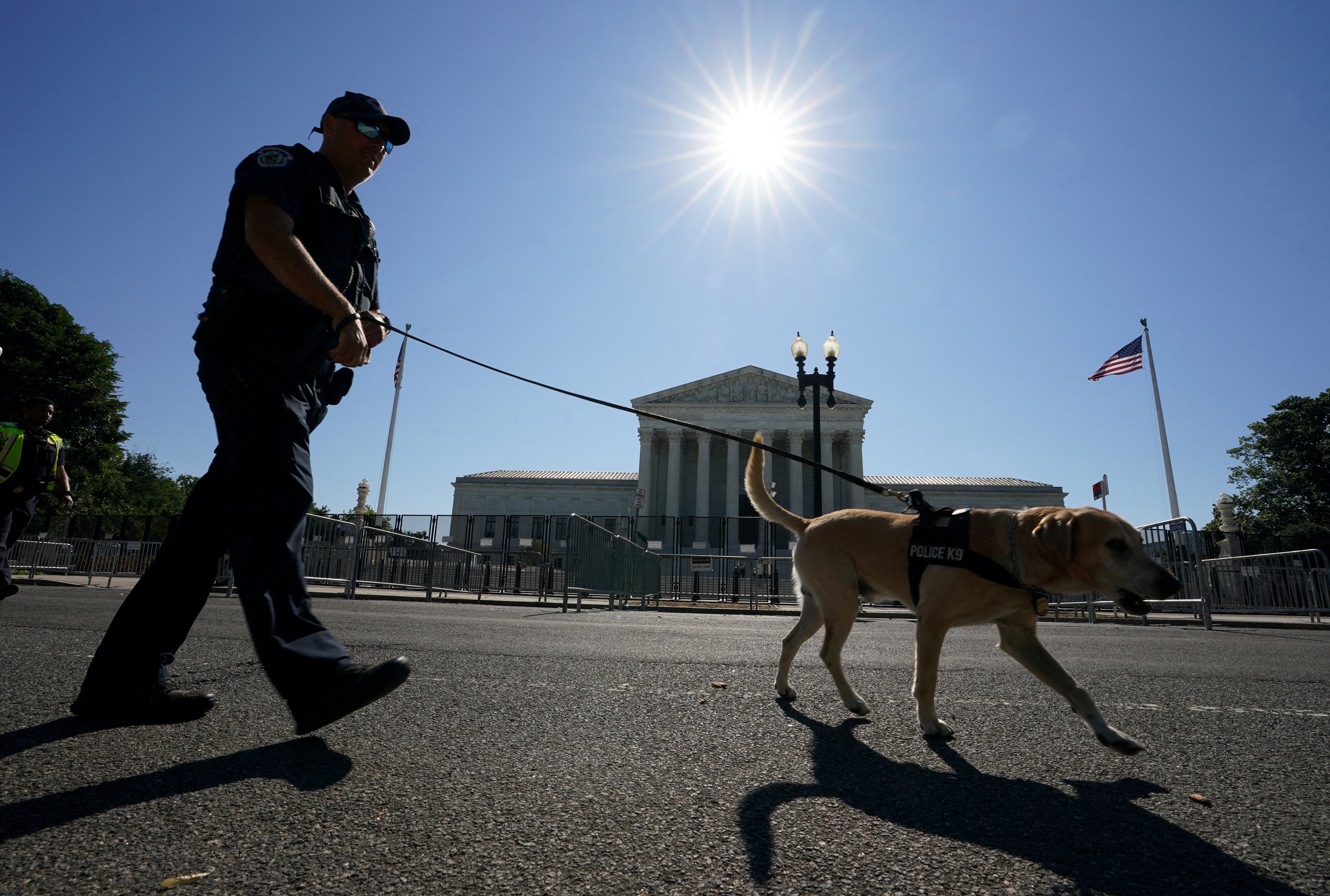 Police officer patrols in front of the Supreme Court in Washington