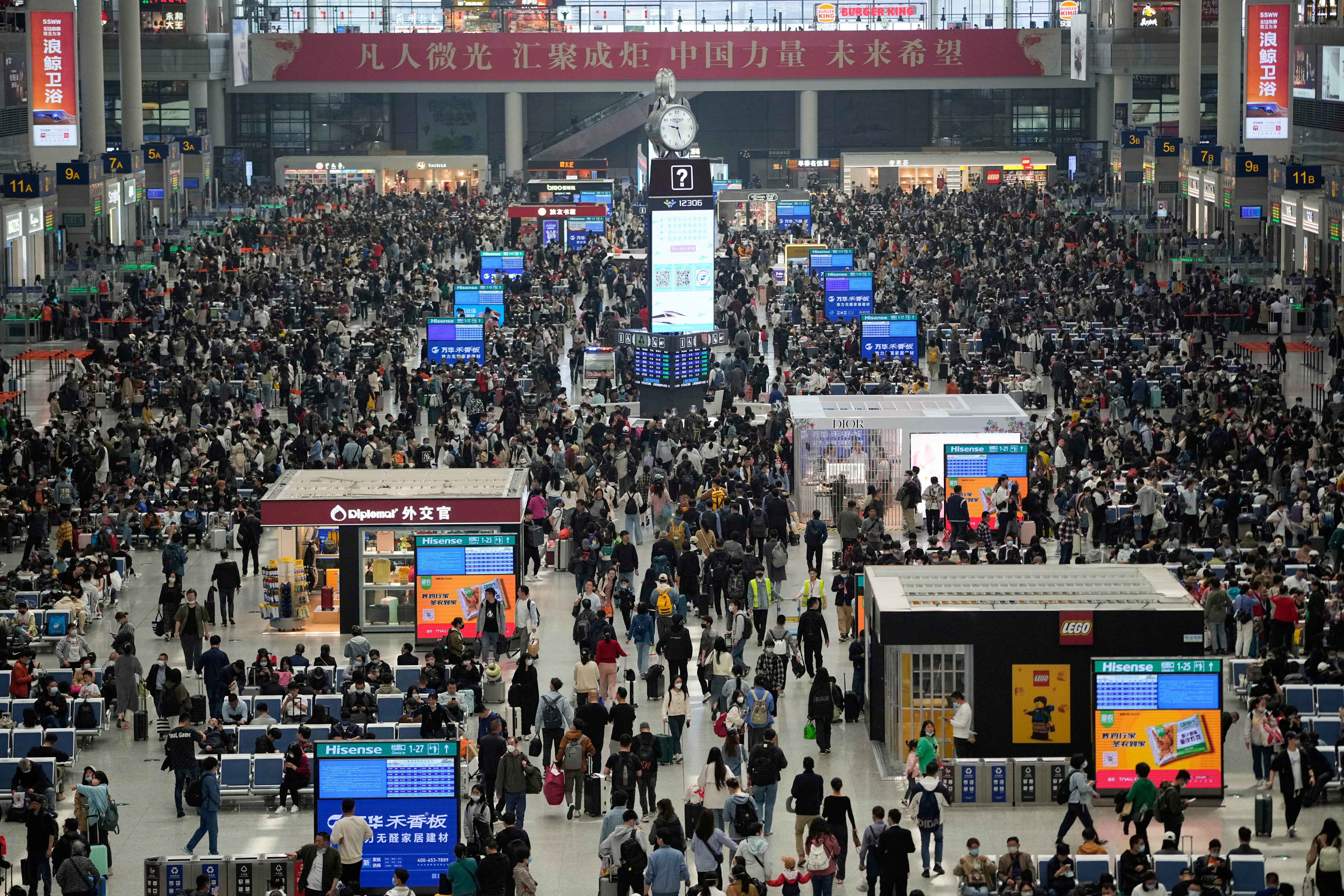 Passengers wait to board at Shanghai Hongqiao Railway Station in Shanghai ahead of the five-day Labor Day holiday.