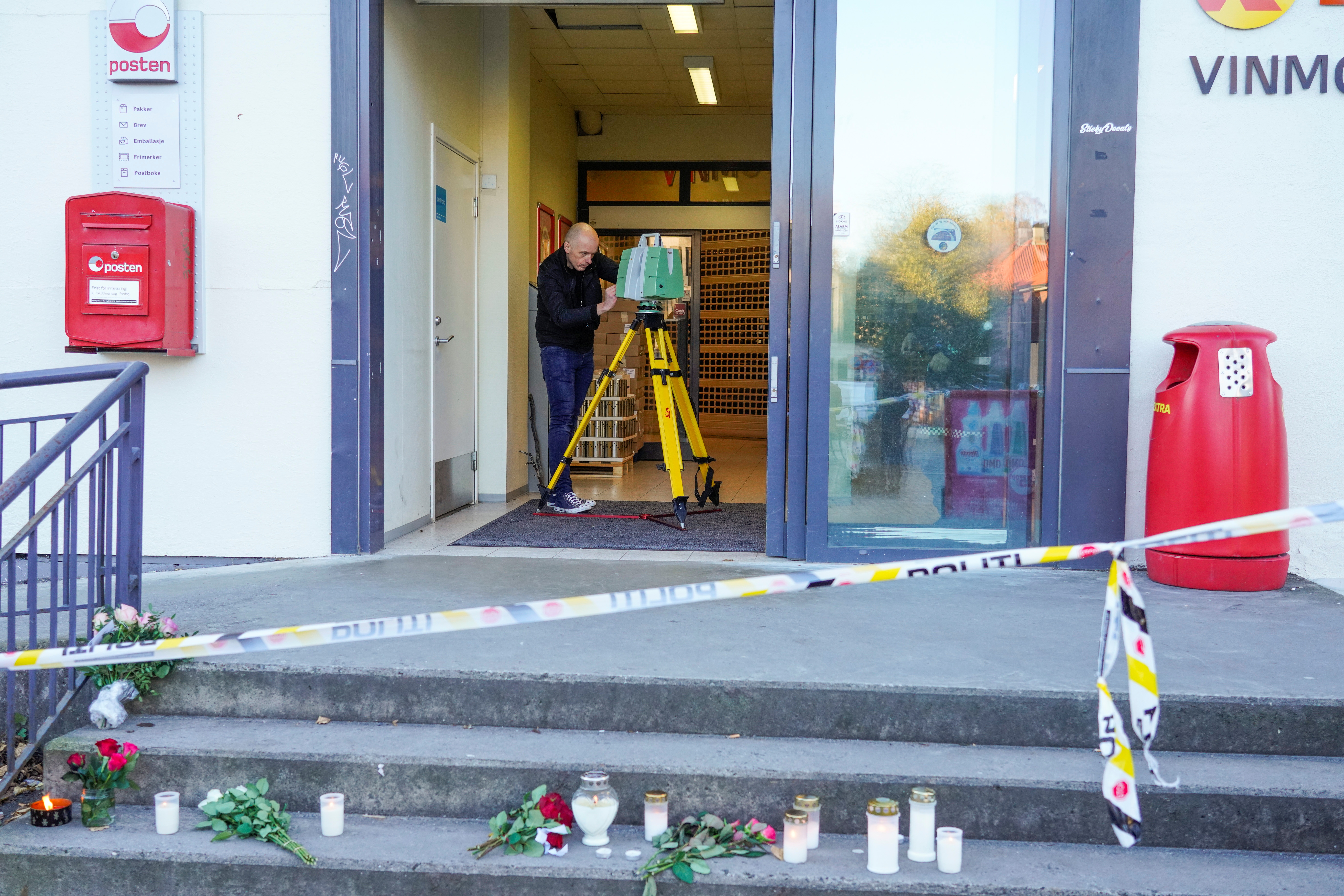 A police officer investigates at the Extra grocery store, where a man killed five people in the city on Wednesday night, in Kongsberg, Norway October 15, 2021. Terje Bendiksby/NTB/via REUTERS 
