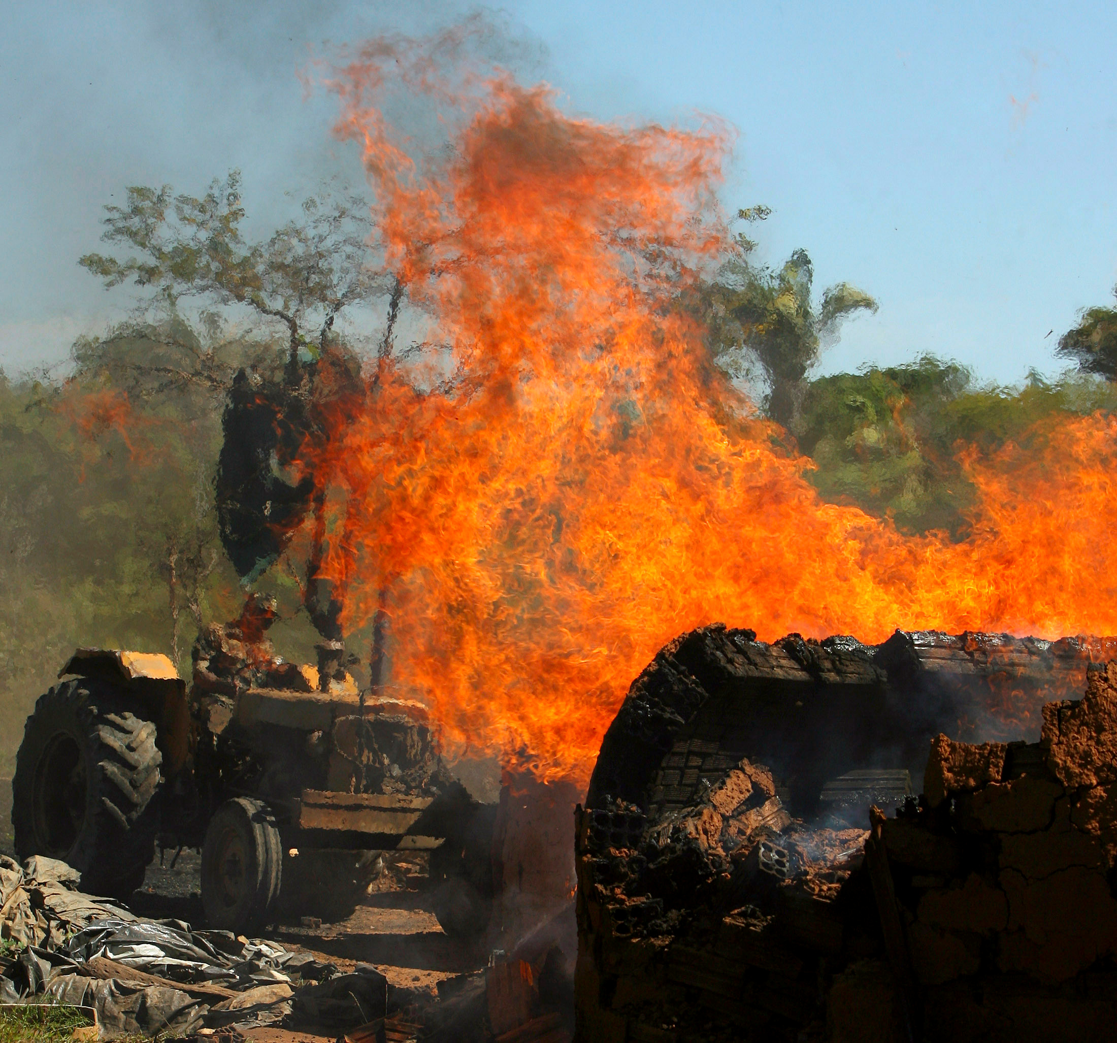 Illegal coal furnaces are destroyed during a raid operation aimed to protect the savannah in Niquelandia