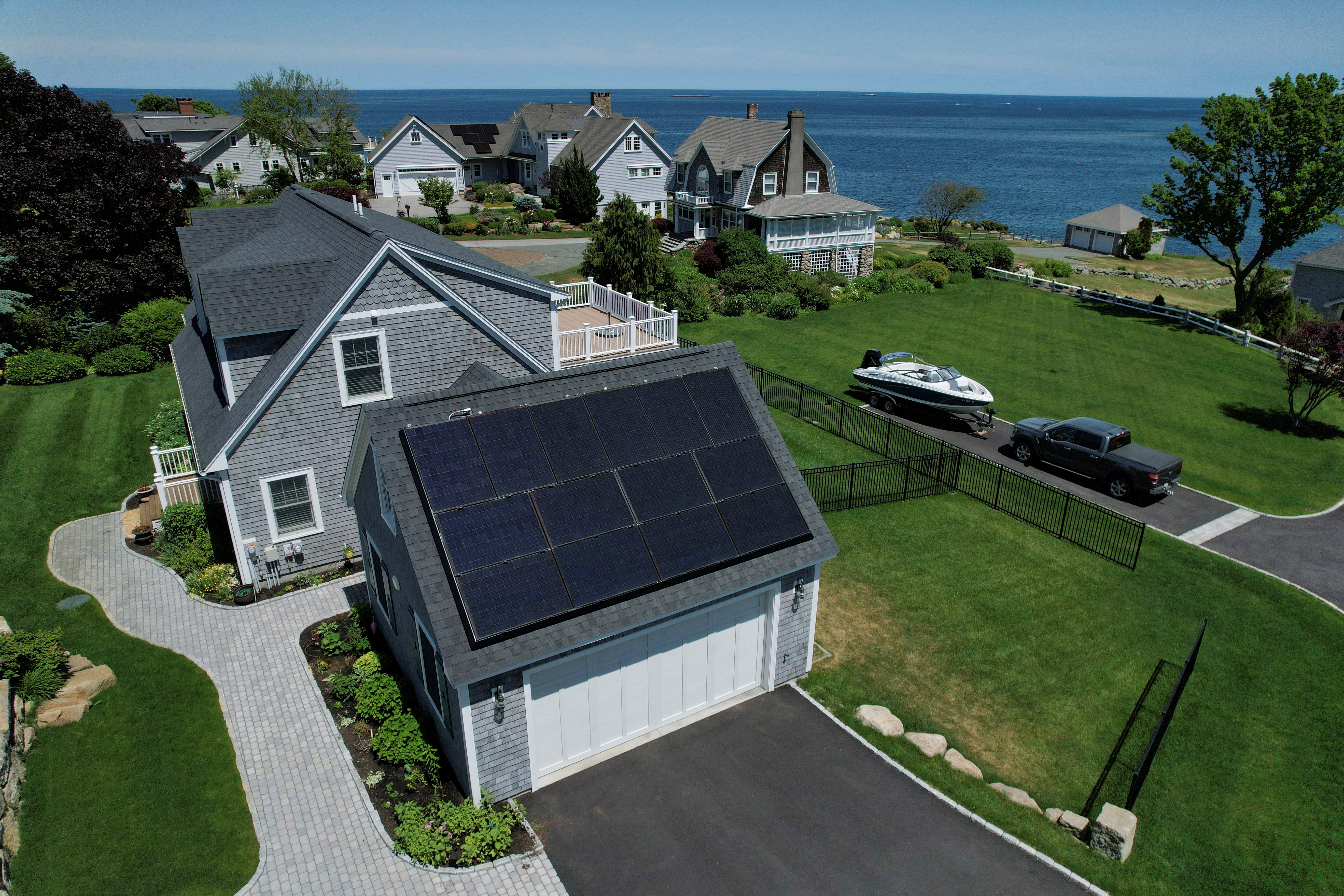 Solar panels create electricity on the roof of a house in Rockport